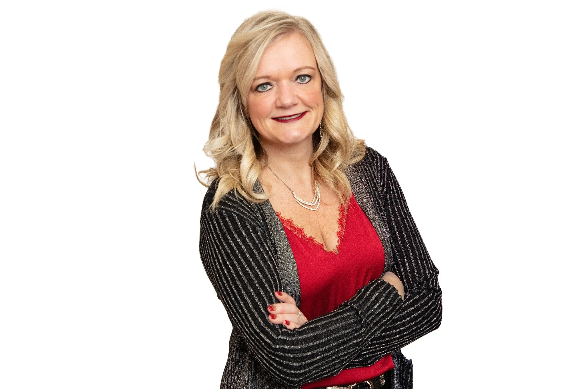 Female in a red shirt with a black open sweater headshot in New Prague, MN