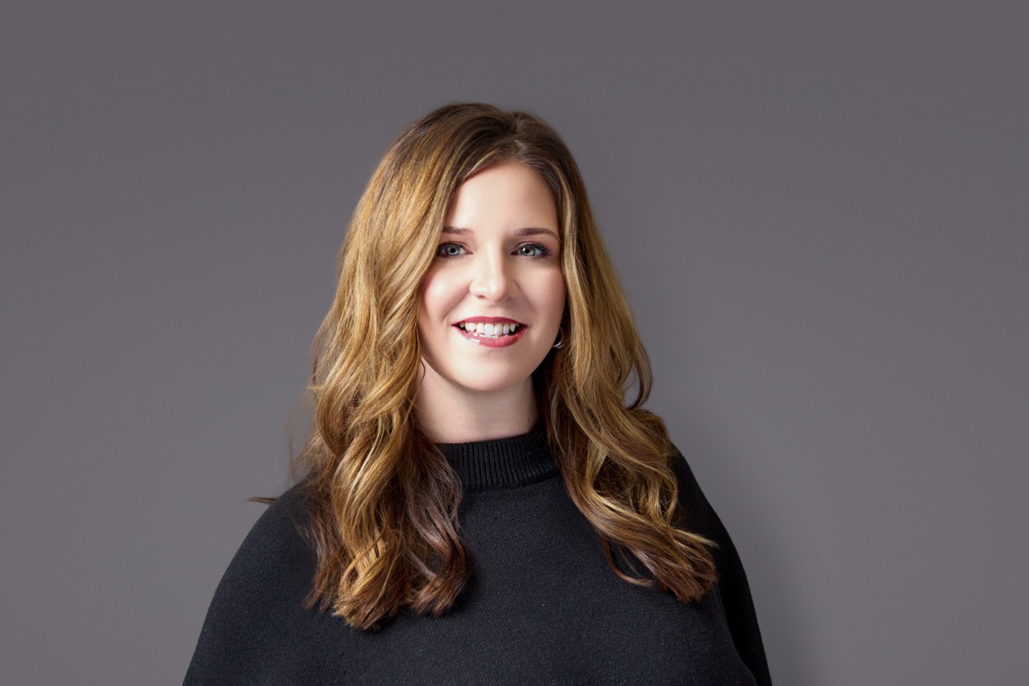 long hair female wearing a black shirt in Prior Lake, MN Chamber of Commerce headshot