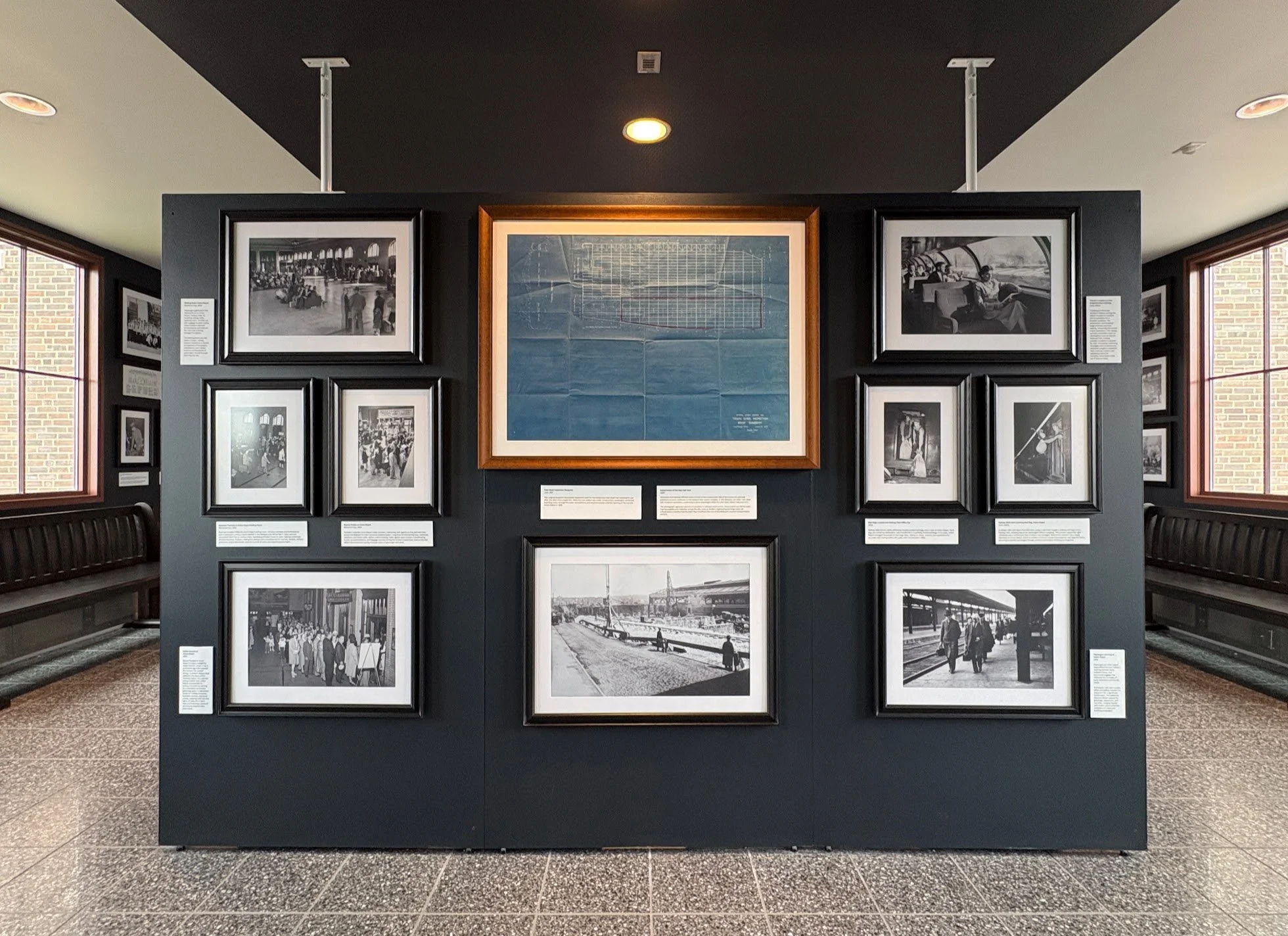 Historic Union Depot photographs and original architectural blueprint displayed in the updated Historic Stair Museum in St. Paul, Minnesota, curated by West Design.