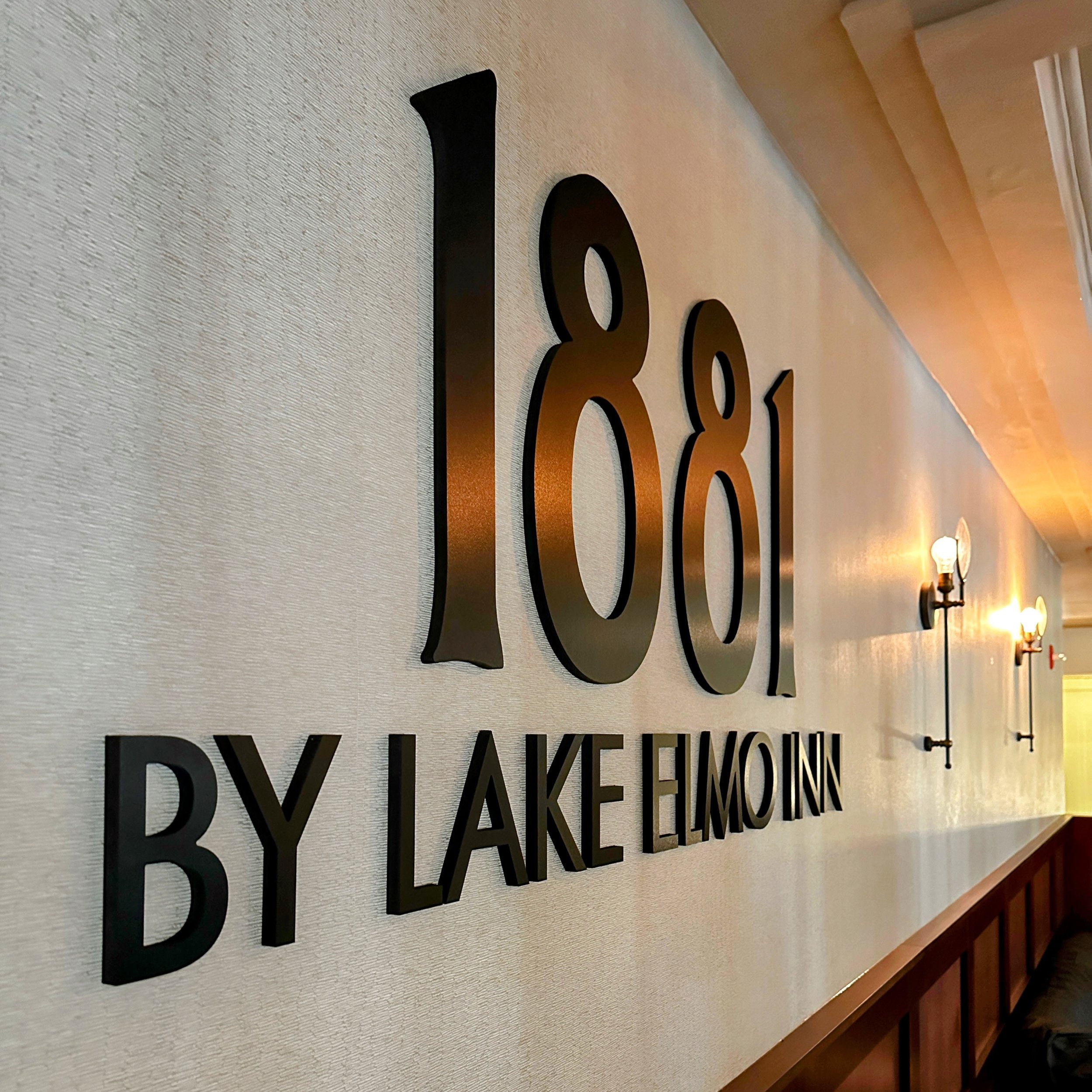 logo of 1881 by lake elmo on wall