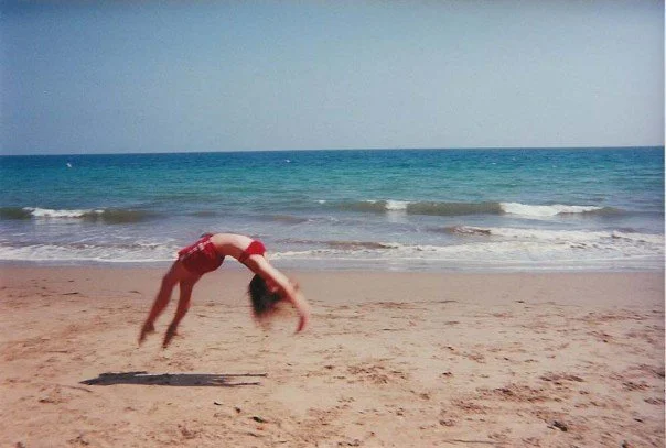 Nik Gymnastics Back Handspring on the Beach Elite Athlete with Chronic Underlying Parasite Infection Root Cause Healing with Nik Heartsong Winged Heart Healing Her Personal Self Healing Journey