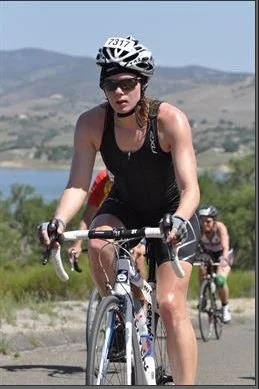 Nik Heartsong Riding her Bike at Wildflower Half Ironman Race Telling Her Personal Healing Journey Leading up To Near Death Experience NDE In 2016