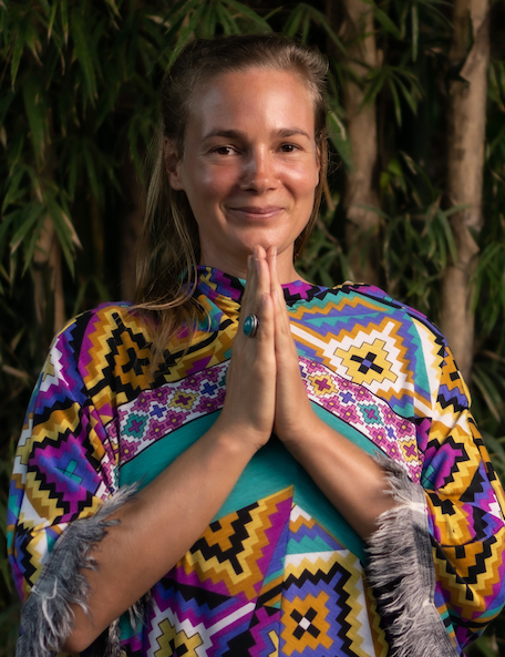 Nik Heartsong, bioresonance therapist and founder of Winged Heart Healing in prayer pose...she is a shaman, medicine woman, energy healer, old soul, self-healed from auto-immune disease (Lyme) and expert on frequency medicine and root cause medicine.