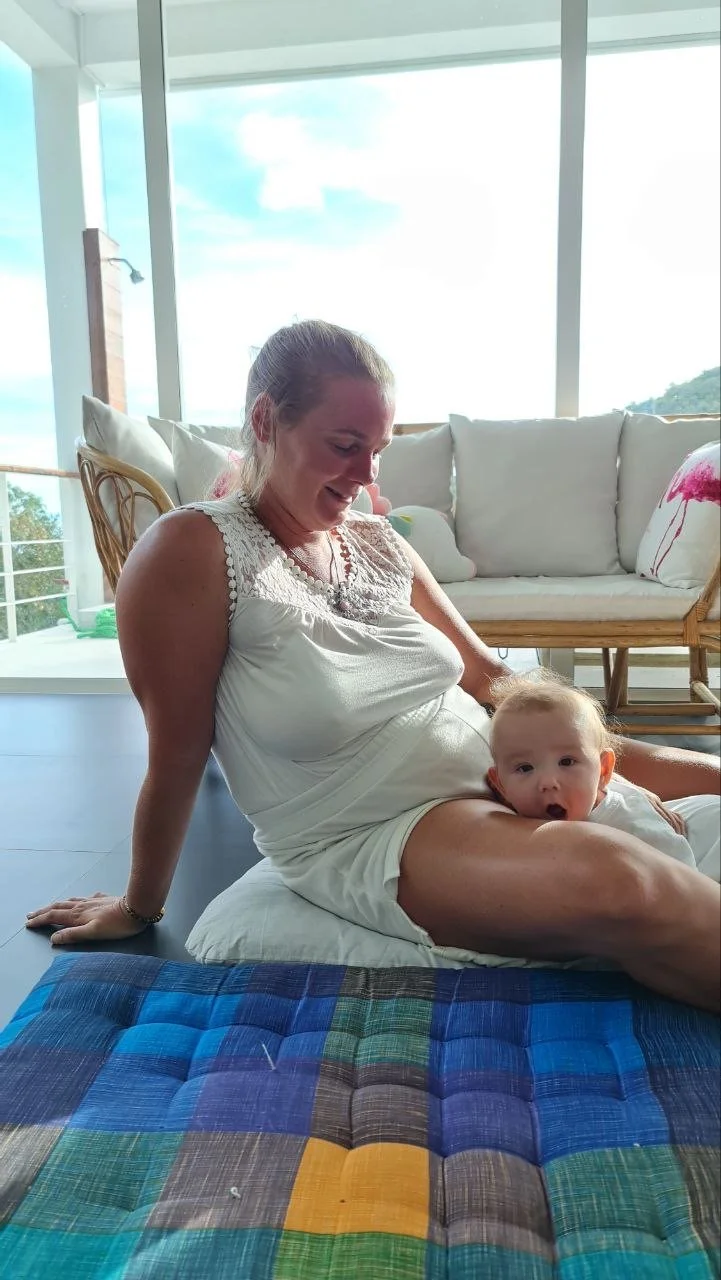 Nik Heartsong with baby Rio on Koh Phangan Thailand after giving birth with extra 50 pounds root cause healing with Winged Heart Healing for natural weight loss personal self healing story