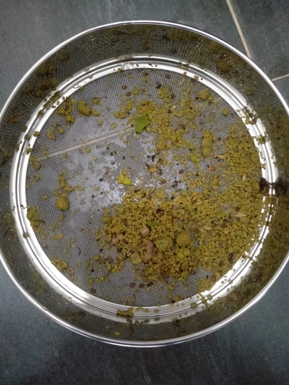 Real Gallstones released during a liver flush with Nik Heartsong Winged Heart Healing over 100 gallstones of various sizes captured in a metal sieve