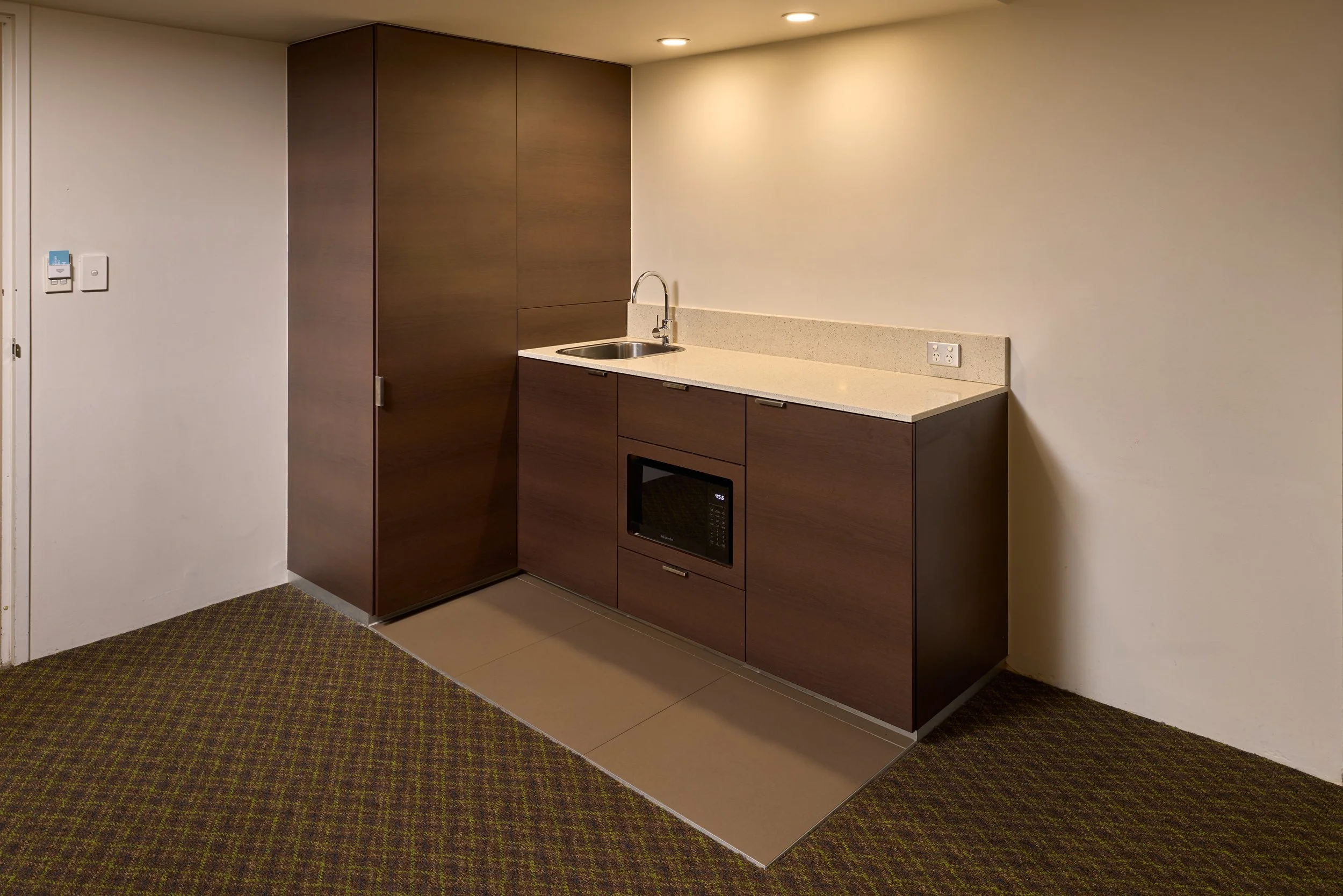 Kitchenette with sink, mini fridge and microwave.jpg