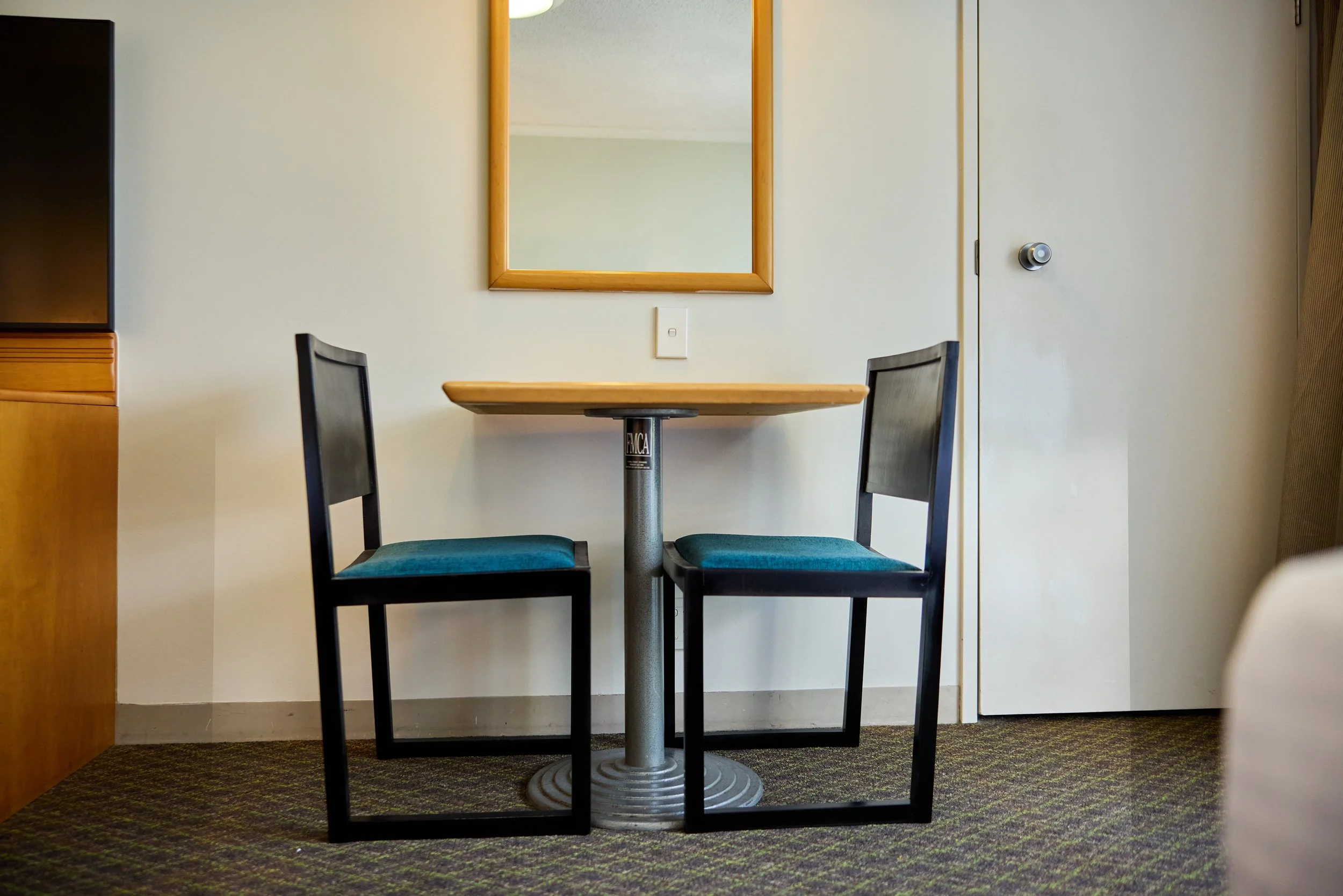 Dining table close up with 2 matching chairs.jpg