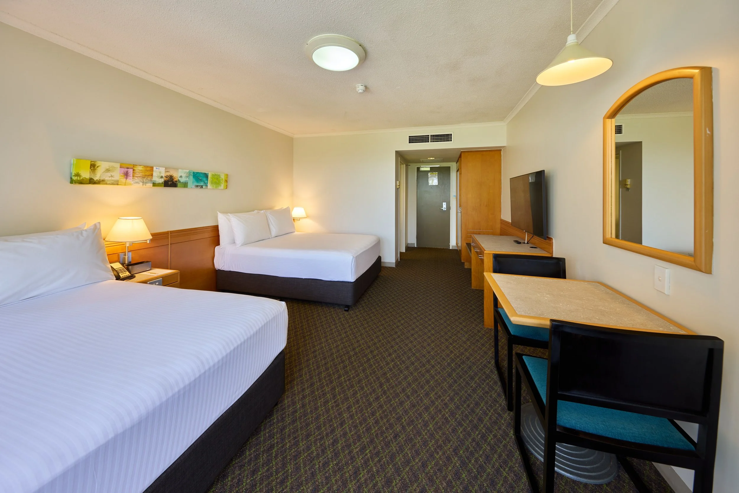 Two double beds with separaate dining table and chairs.jpg