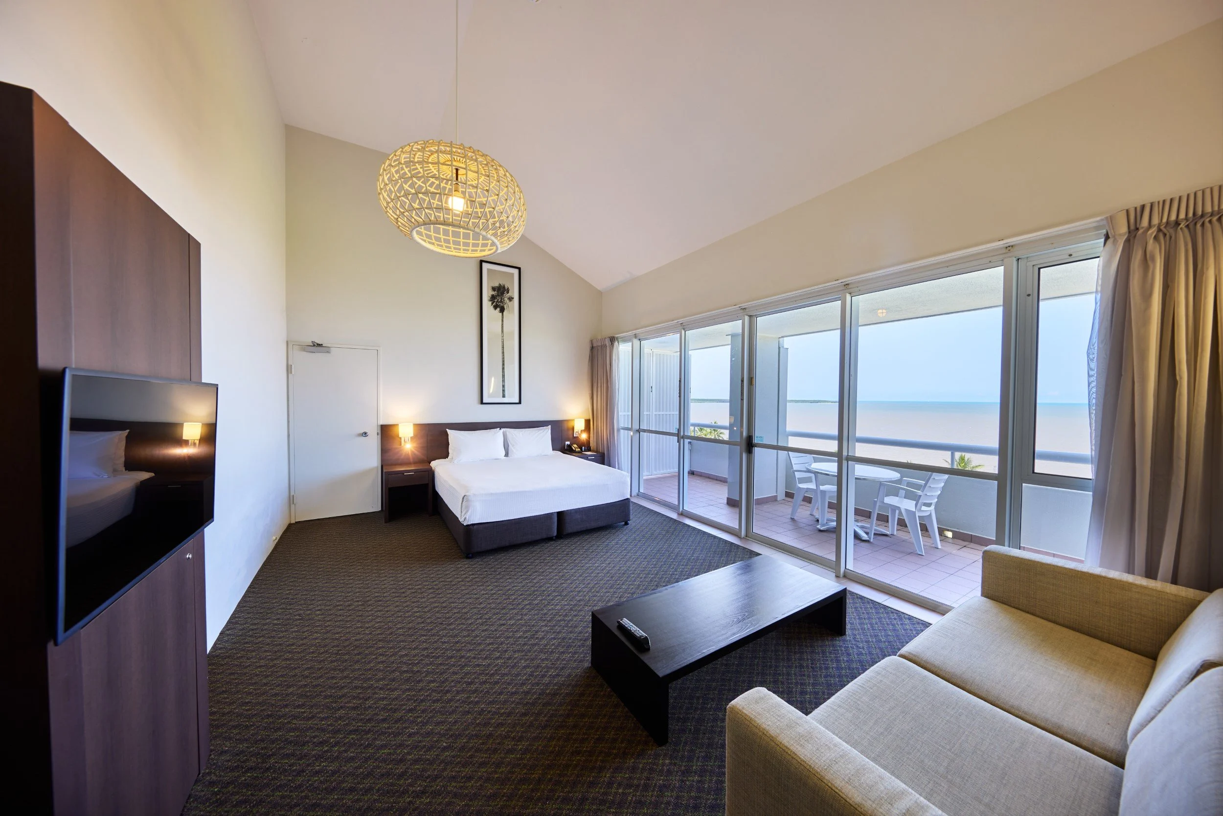 King bed with view to balcony and the sea.jpg