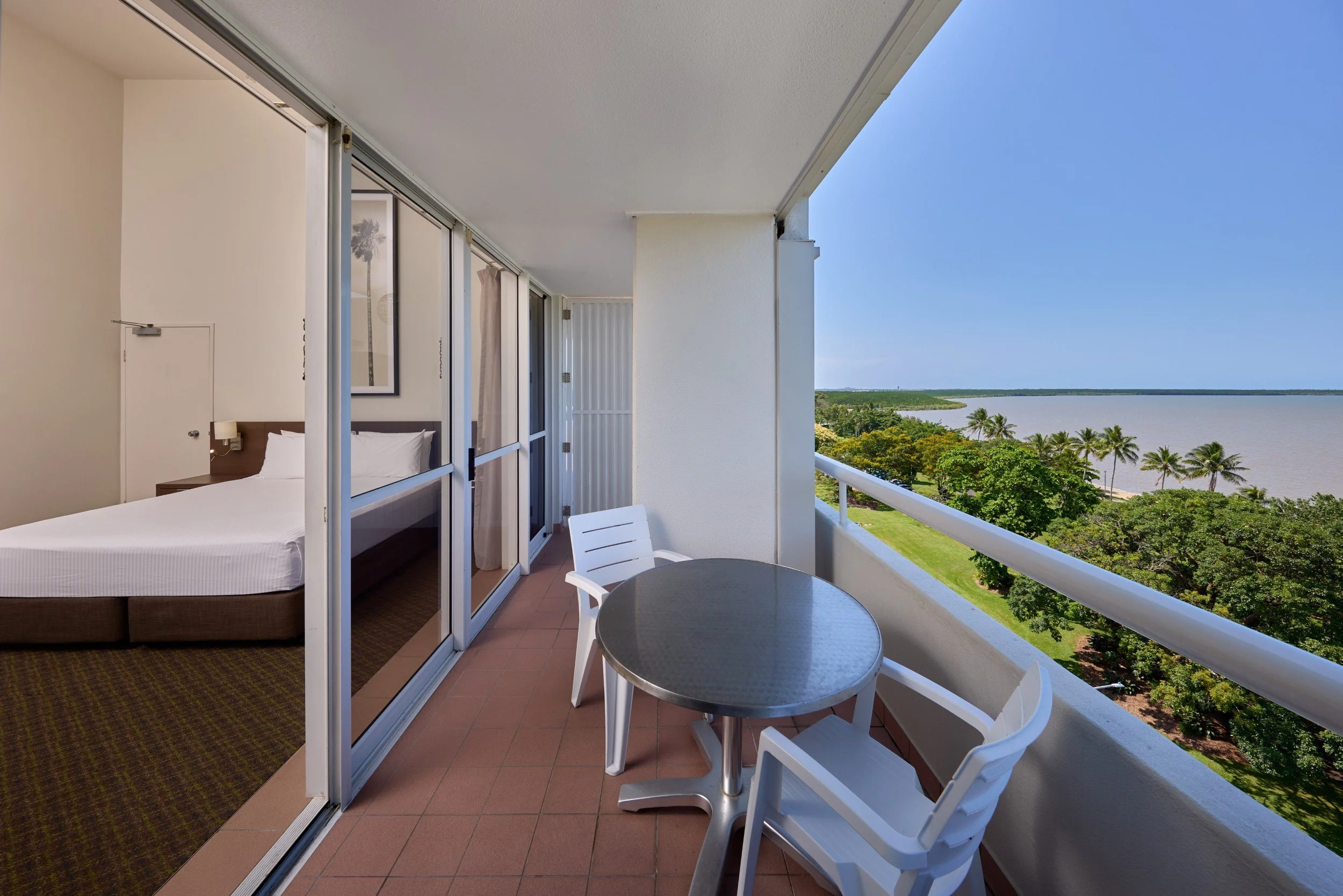 Private balcony with table and 2 chairs and water views.jpg