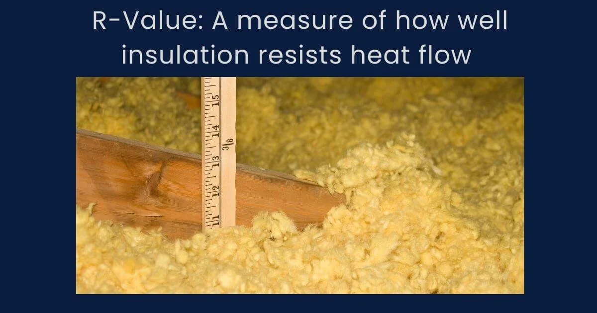 Image of blown in insulation with a ruler sticking out of it to measure how deep the insulation is.
