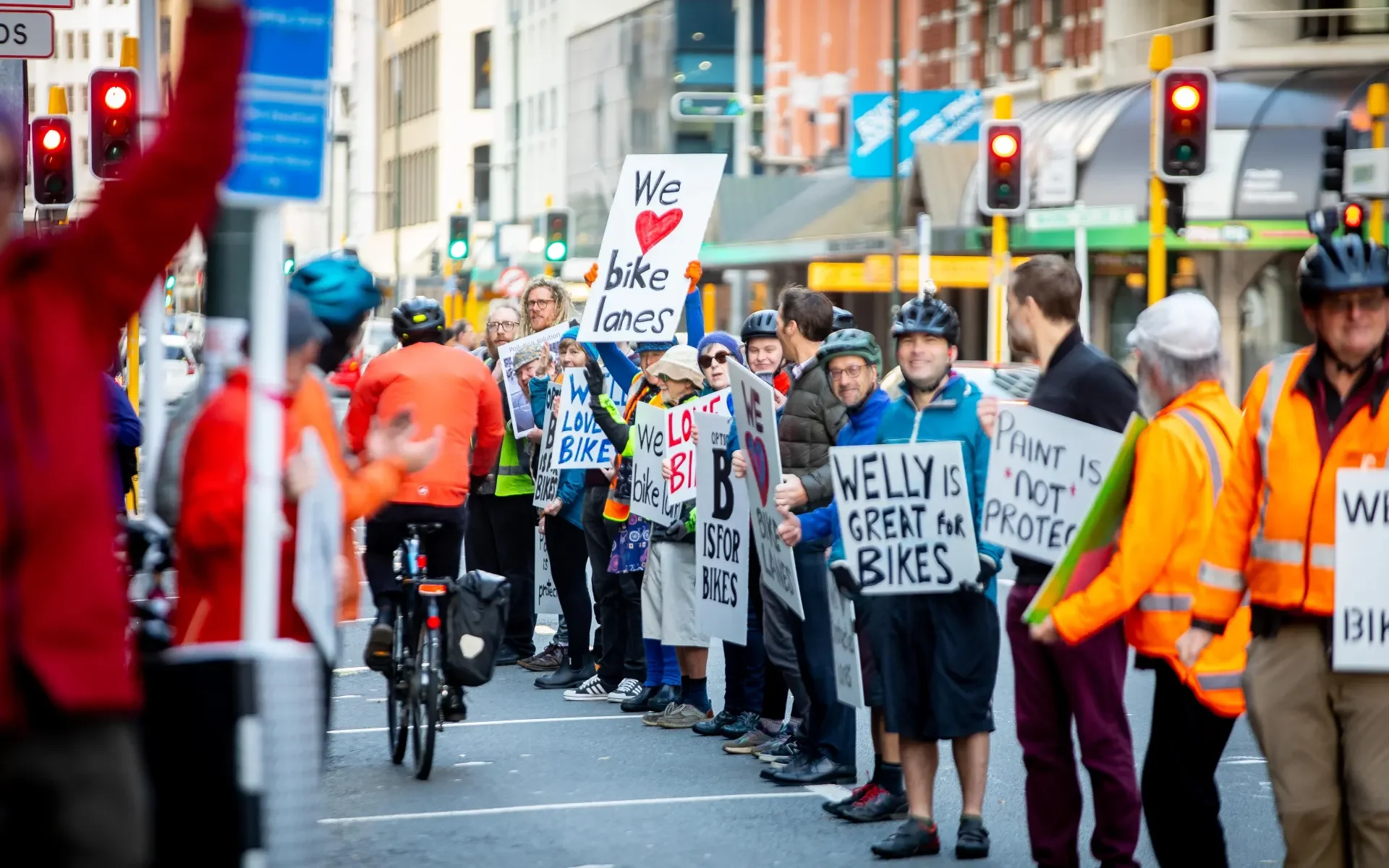 Human chain bike lane fills Wellington street objecting proposed cuts to infrastructure