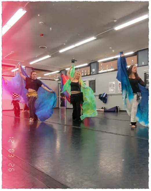 Lacey belly dance students practice veil dance during class at Kinetic Dance Academy