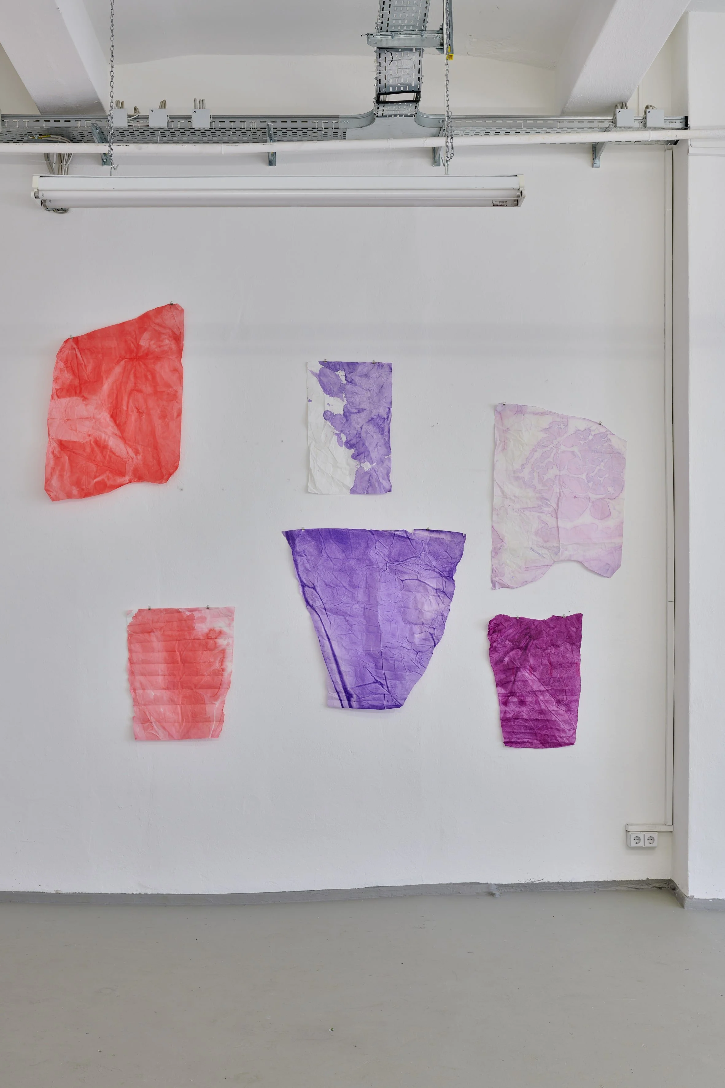 Vertical installation view of colourful works by Marie Birkedal in Godspeed / Savage Glitter.
