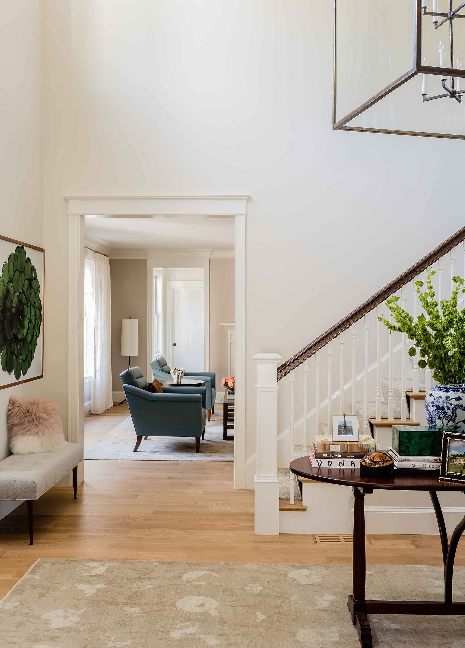 Entryway with white walls and tan rug-Kate Maloney Interior Design