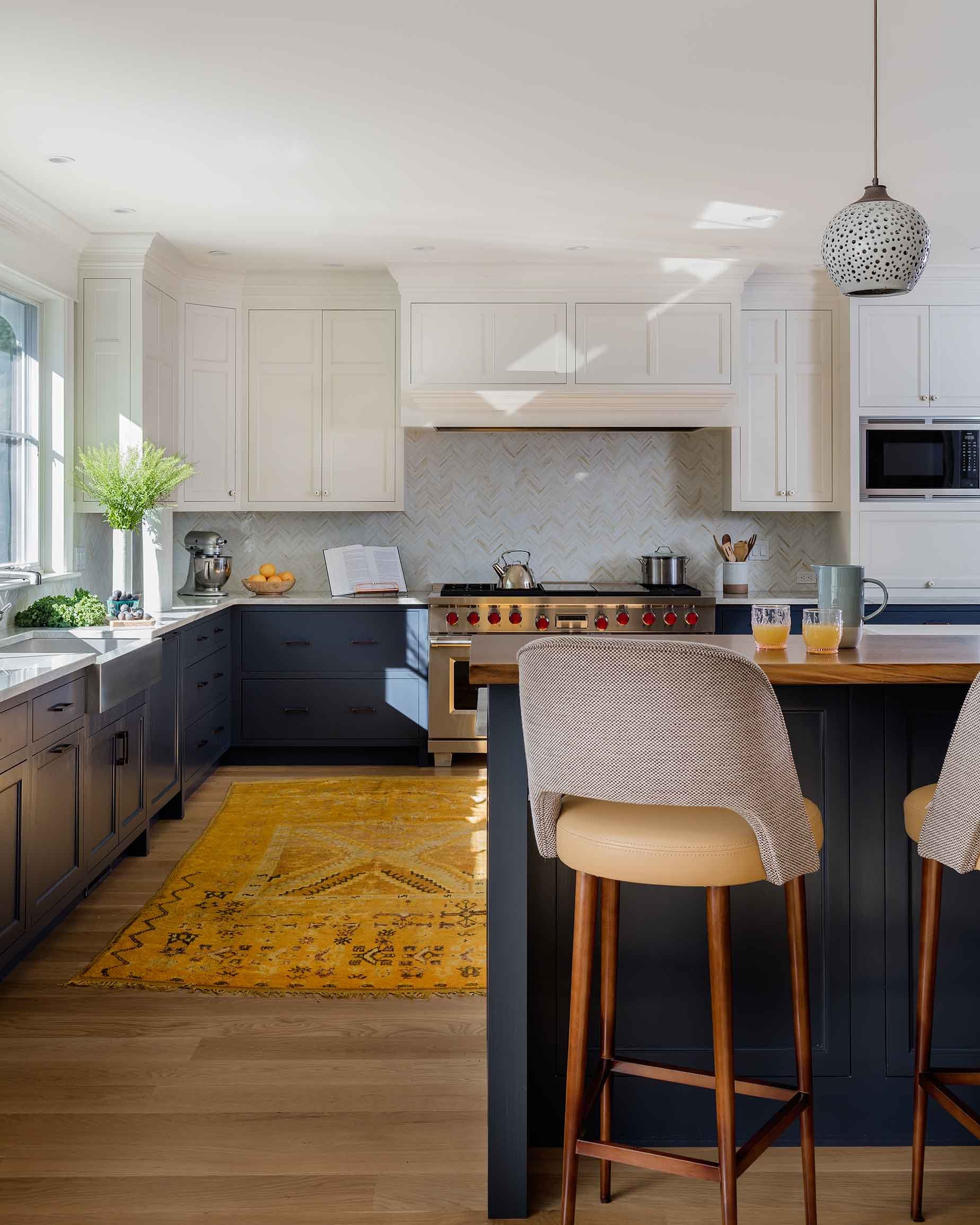 Kitchen with blue lower cabinets and white upper cabinets in Wayland, MA-Kate Maloney Interior Design
