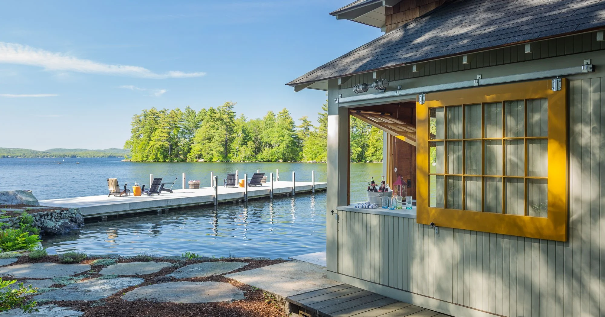 Boat dock and boat house bar on Lake Sunapee-Kate Maloney Interior Design