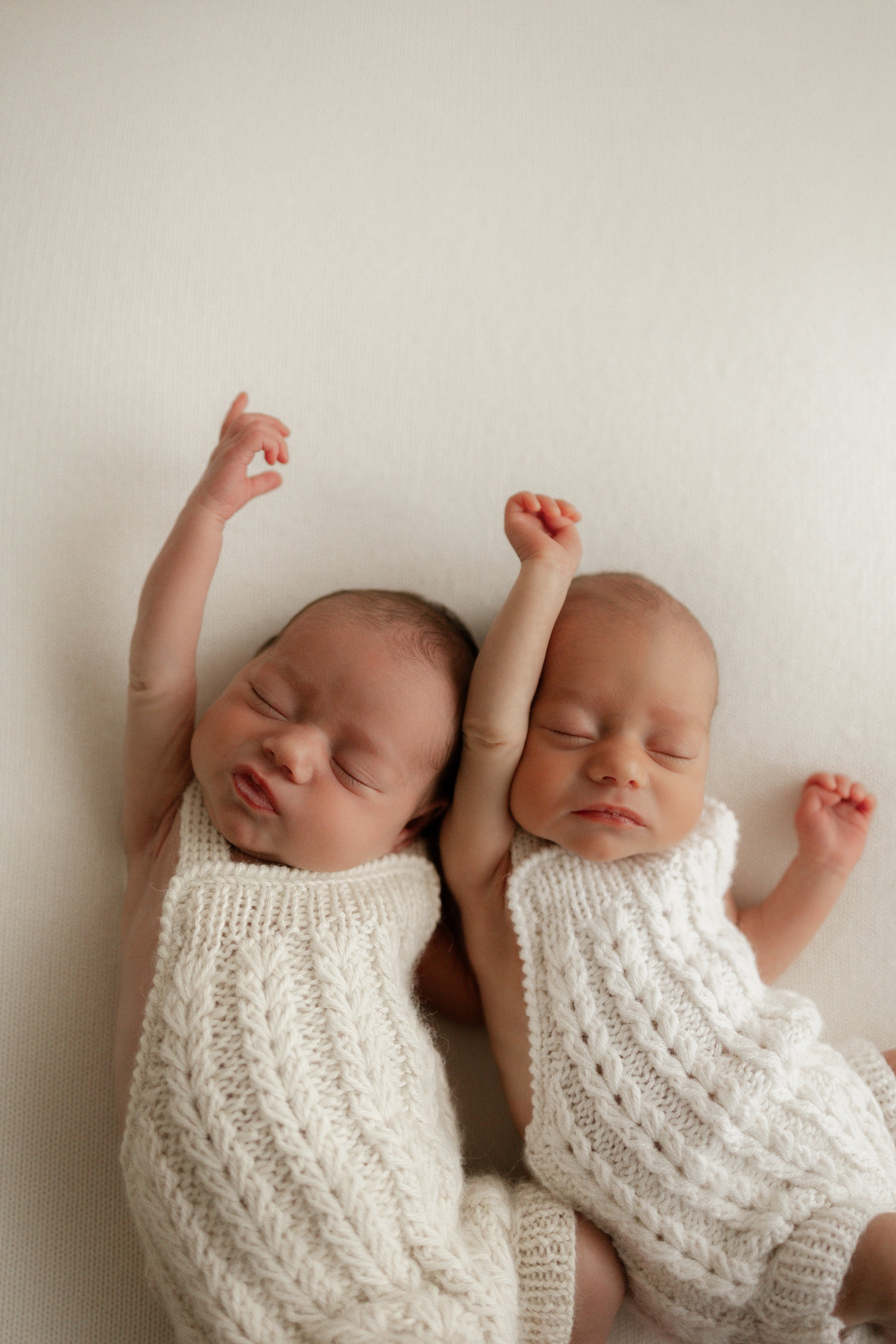 Newborn twins sleepy stretches 
