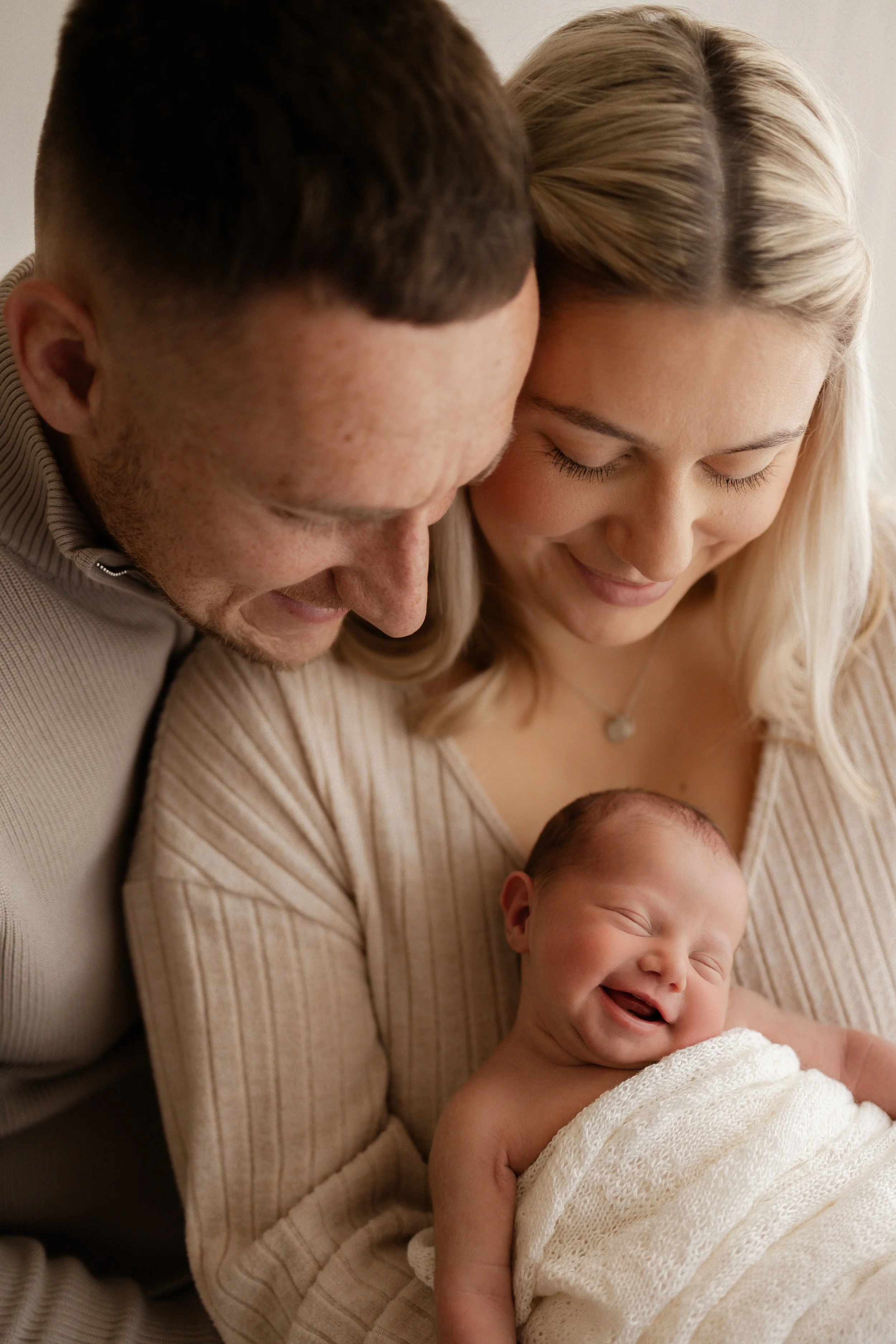 a smiley baby, happy family picture