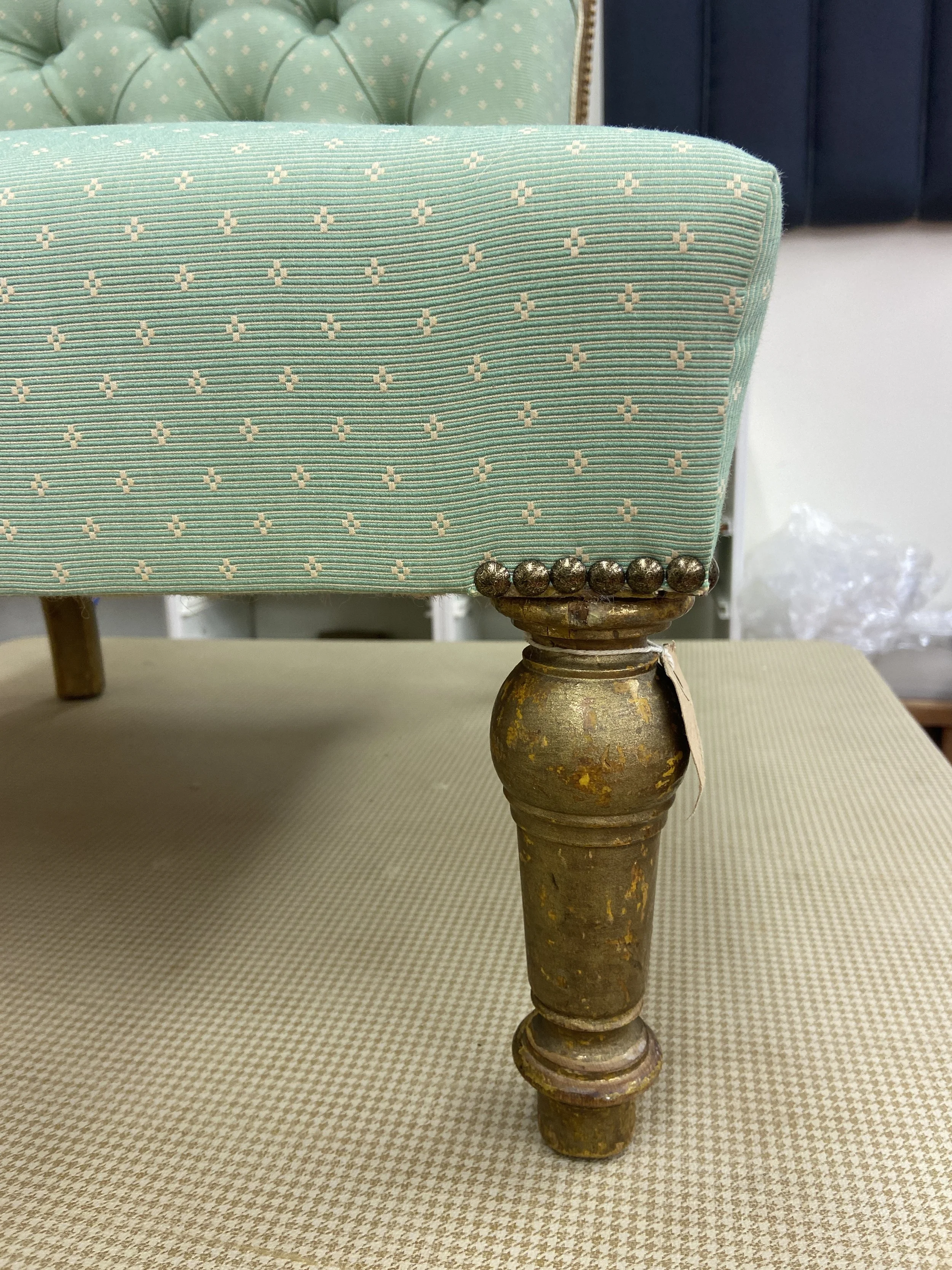 Close up of decorative nail detail for traditional nursing chair