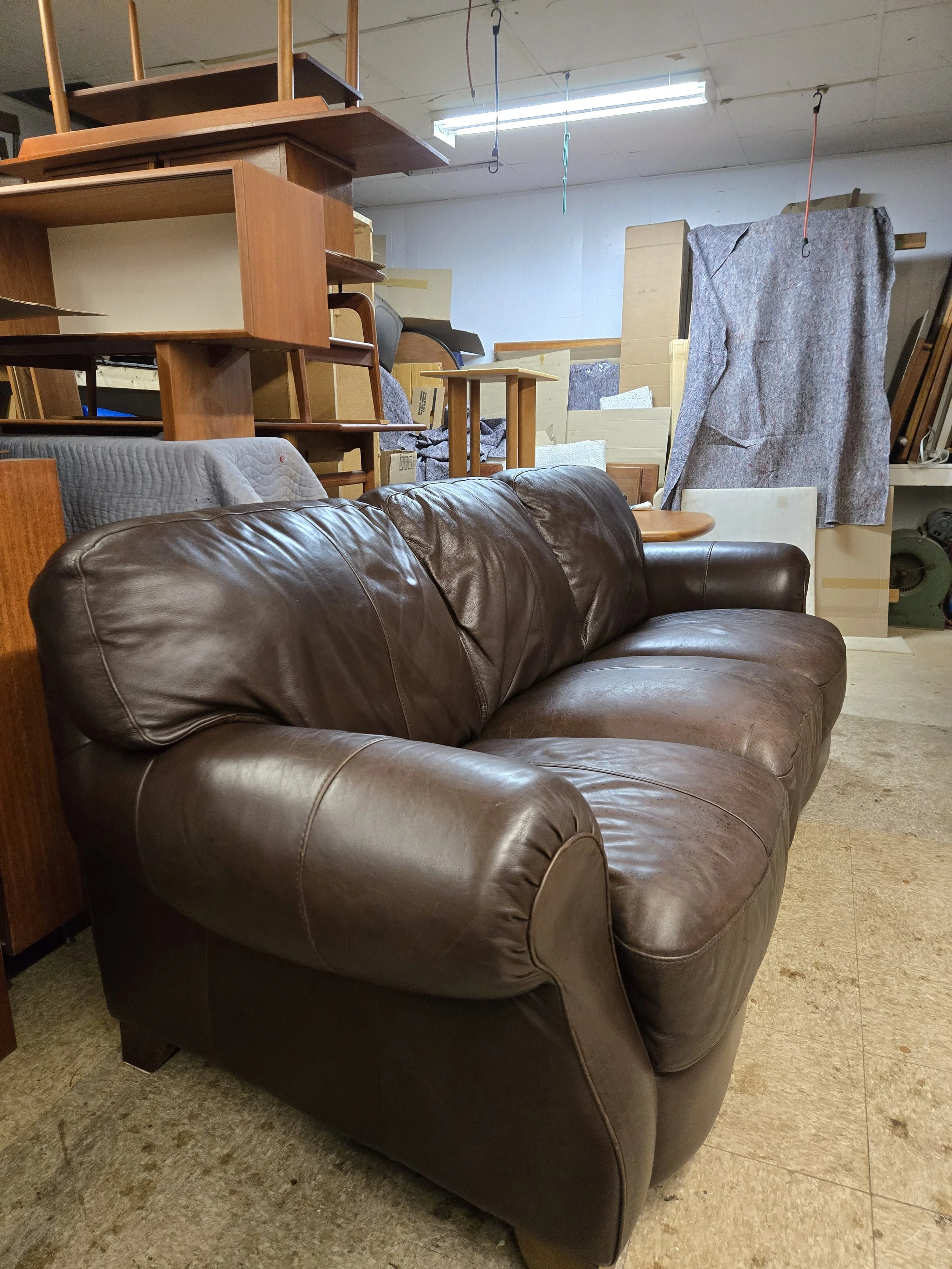 Sculptural Vintage leather chair and ottoman