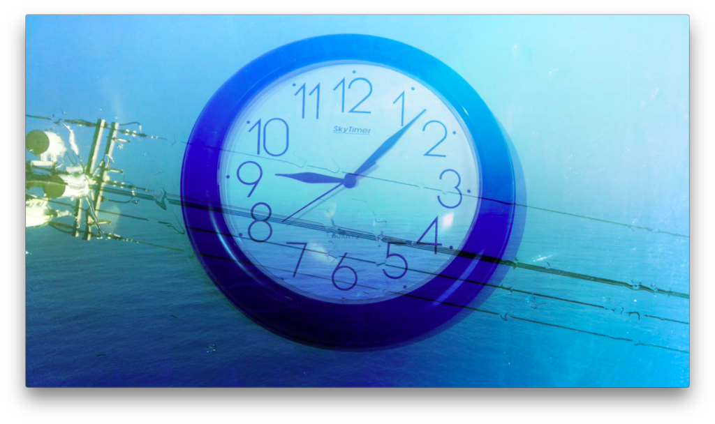 A clock overlayed with an image of a power transmission tower and wires, with a blue sky background.