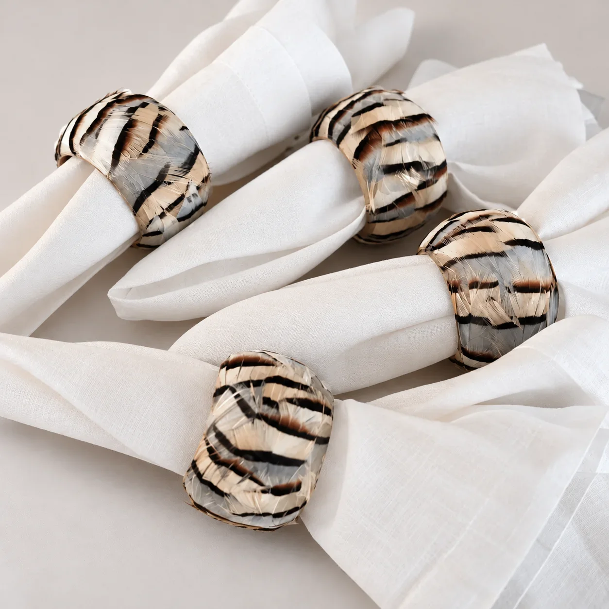 striped-golden-pheasant-feathered-napkin-rings-product-shot (3).webp