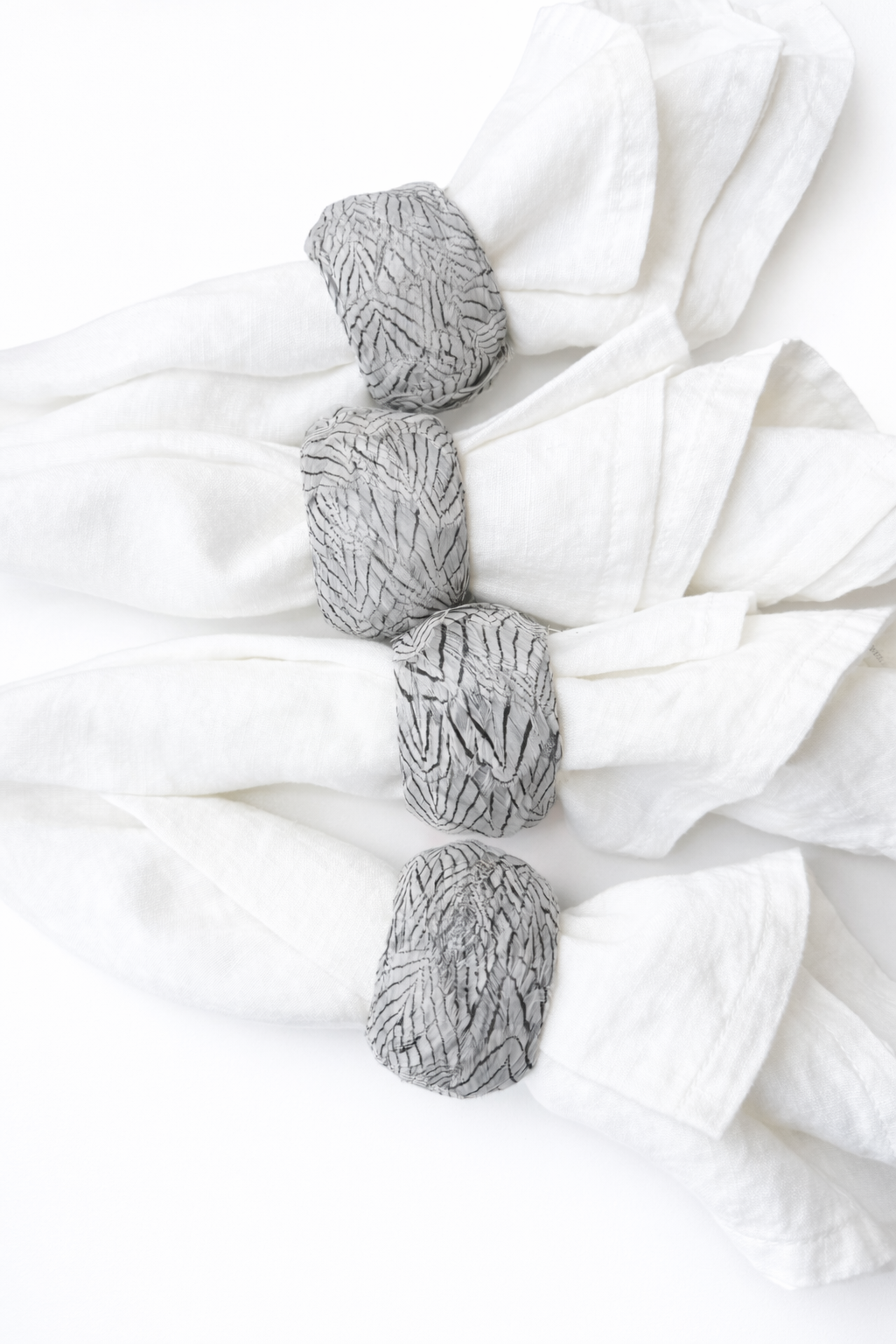 Elegant linen napkins with textured rings (1).png