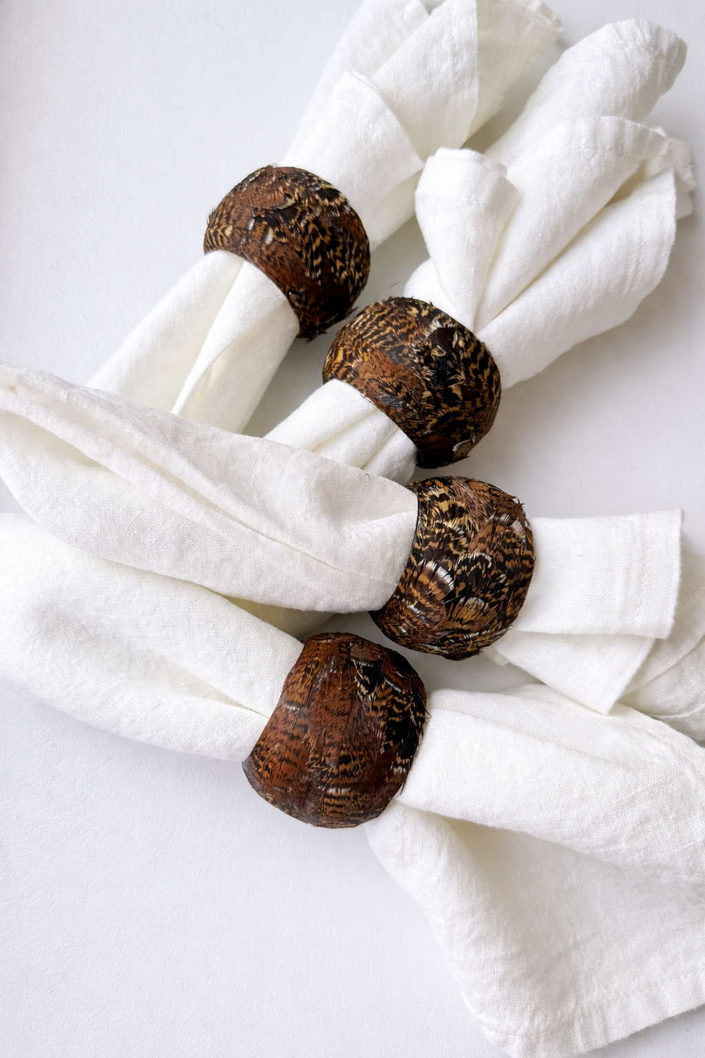 Feathered elegance on linen napkins (1).png