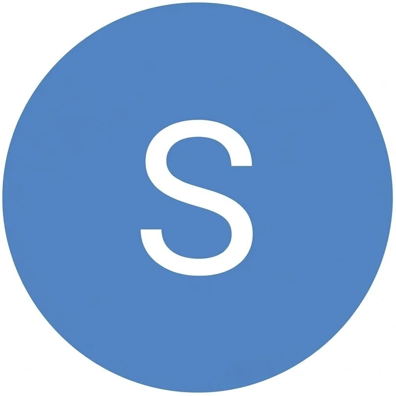 Blue circle with a white letter 'S' in the center, representing the Skype logo.