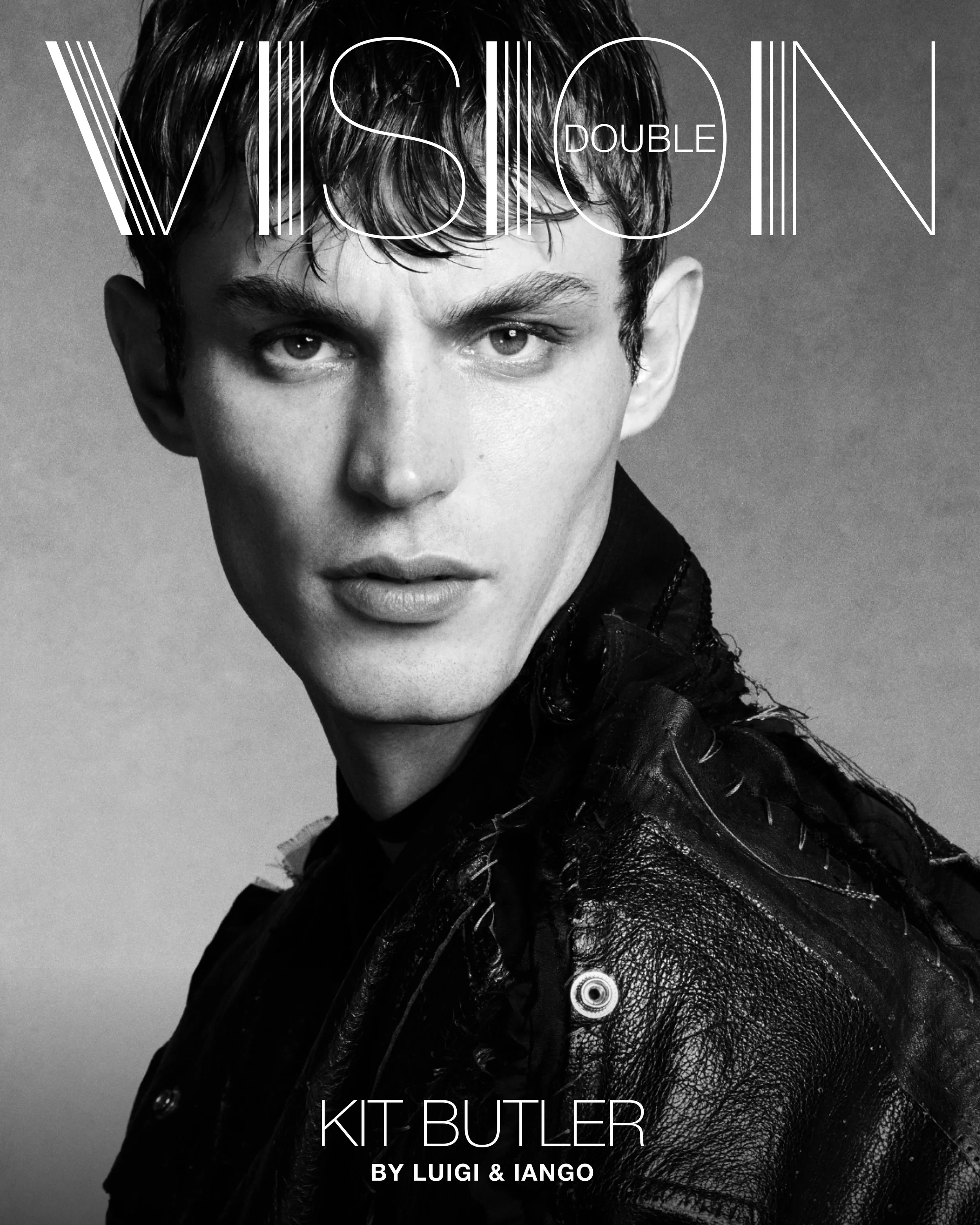 Black and white photo of a young man with short hair wearing a leather jacket, looking directly at the camera. KIT BUTLER Conor O'Driscoll