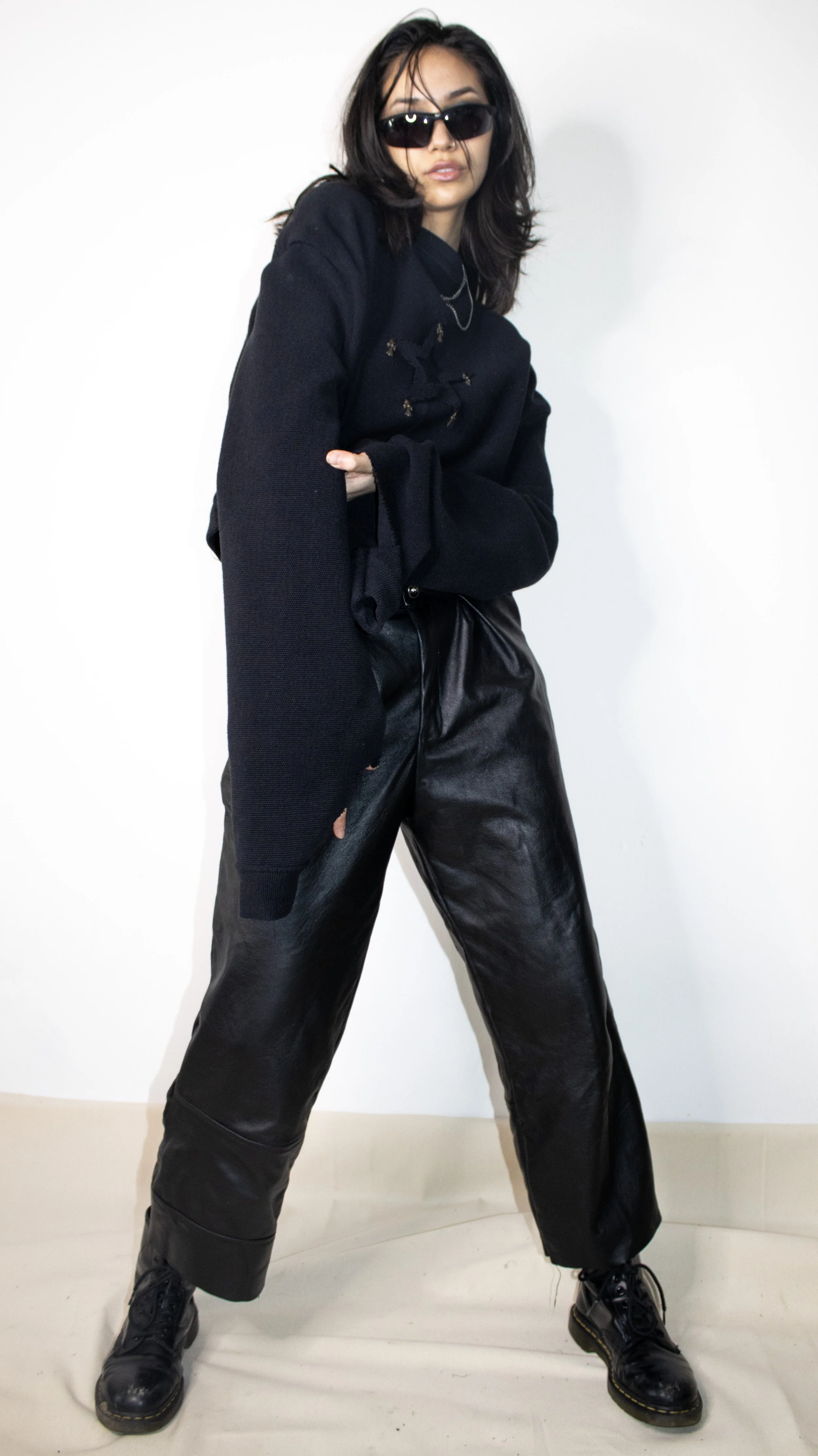 sharon bruck wearing leather pants workship crewneck by conor odriscoll cult collection