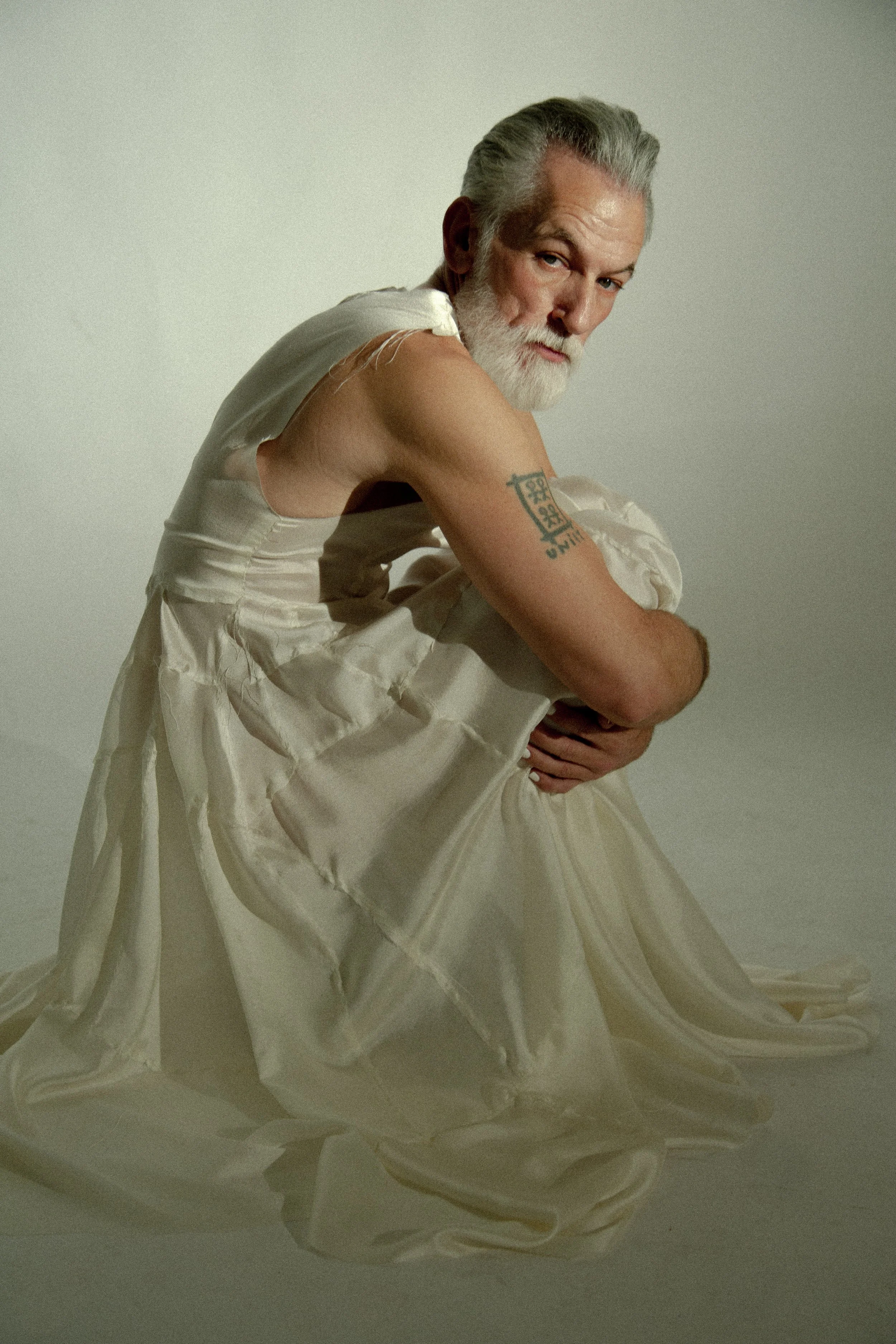 david hand in handsewn silk mens dress by conor odriscoll. sexual narcissist collection look 3 autosexual. photography by timothy cheng. shot in new york city. shoes masion margiela.