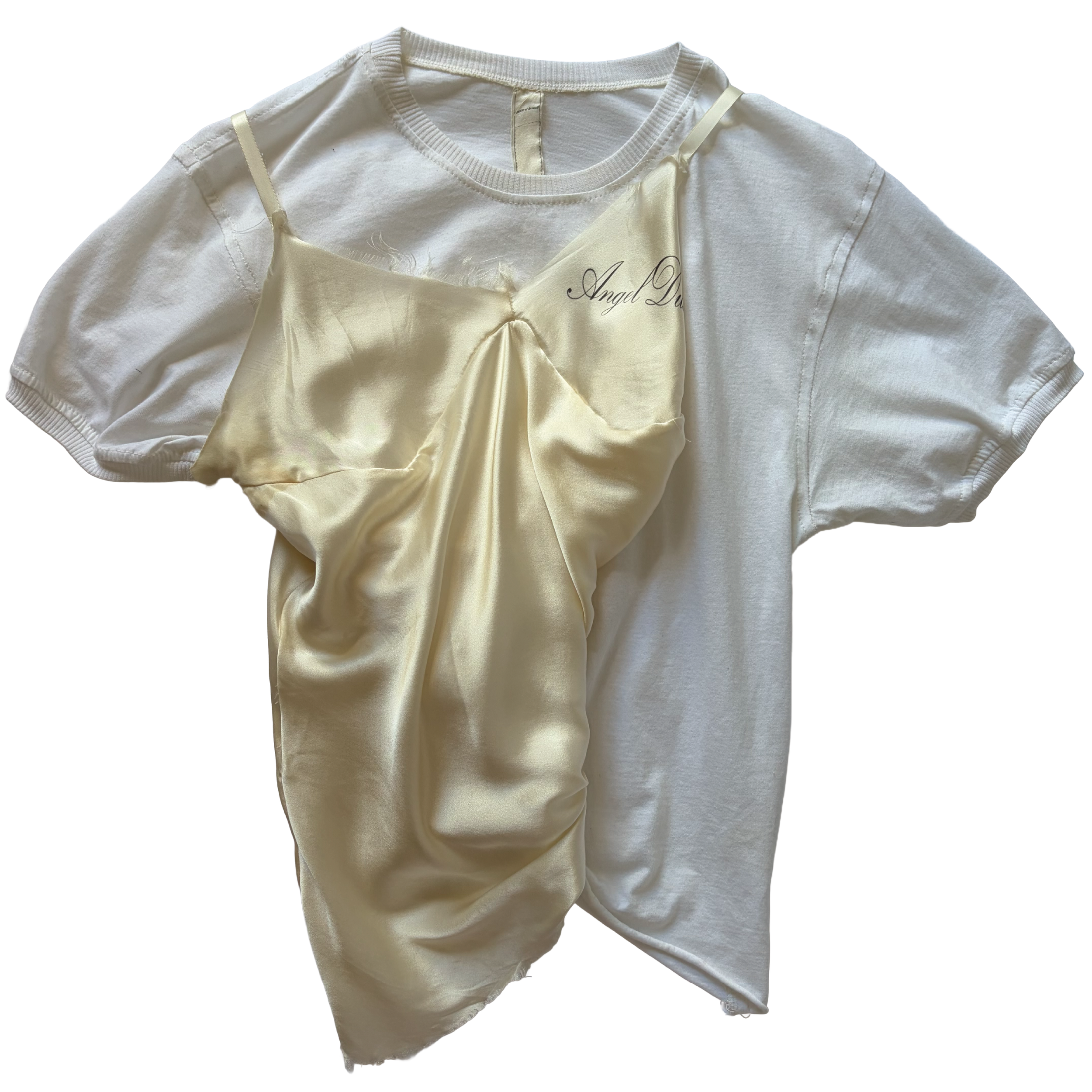 A white T-shirt with a yellow satin camisole layered over it. The camisole has thin straps and the words 'Angel Dust' written on it by conor o'driscoll.