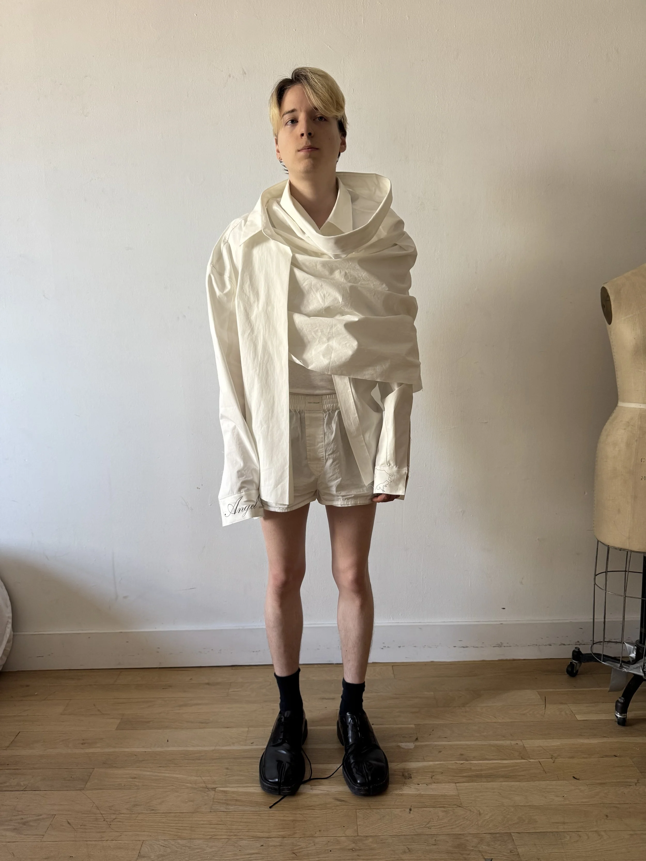 conor o’driscoll conor odriscoll. new york runway fashion designer atelier. 2026 model wearing WRAP DRESS SHIRT CONOR O'DRISCOLL GORAN TOSIC