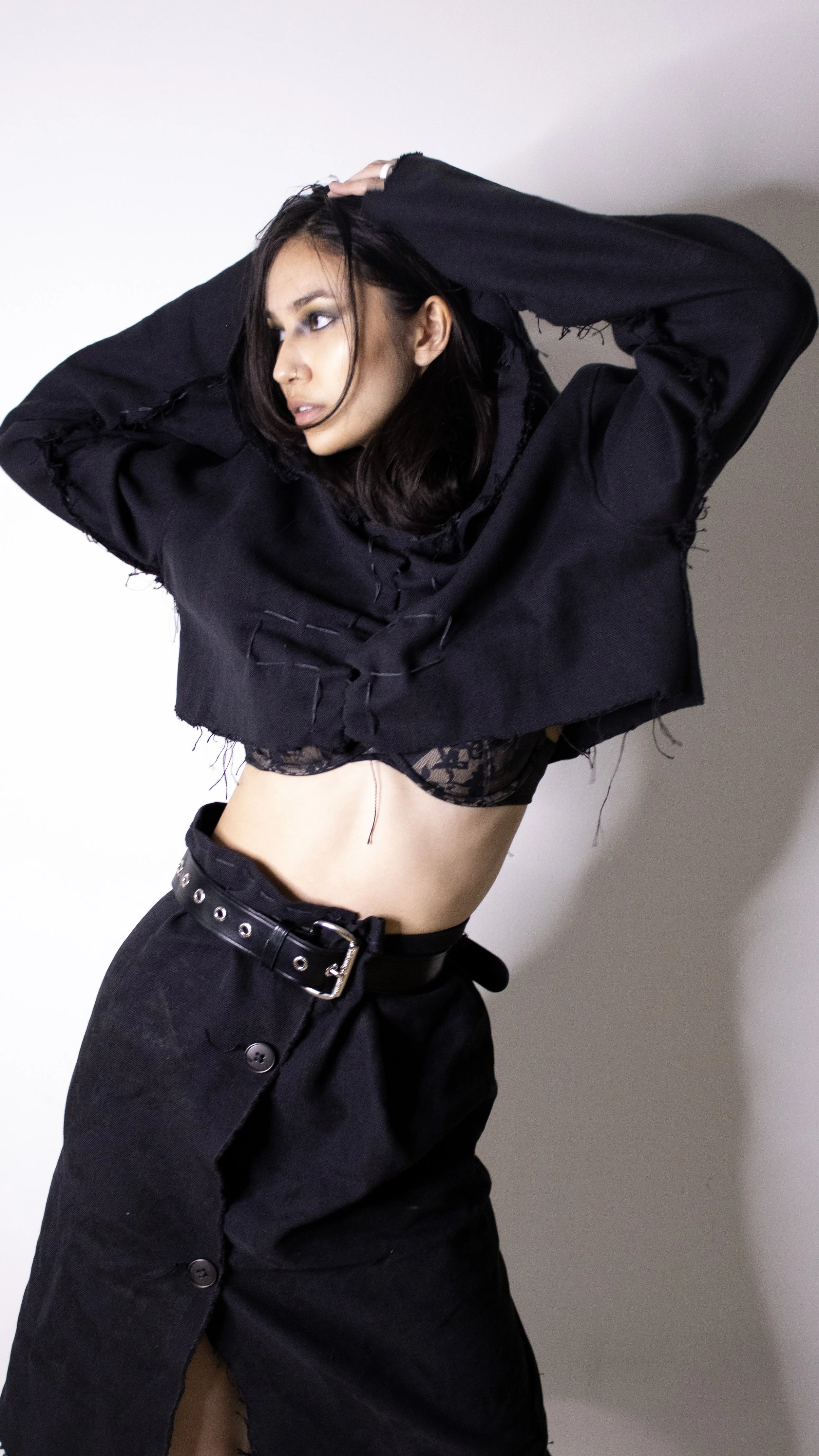 sharon bruck wearing cropped cross hoodie and printed skirt by conor odriscoll cult collection