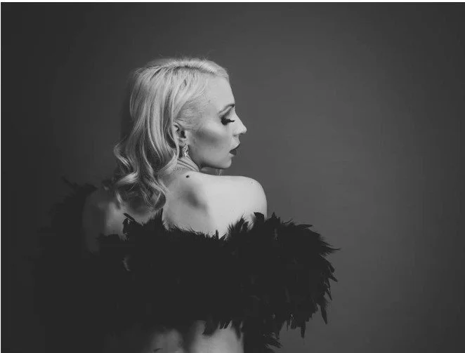 Burlesque dancer striking a fierce, playful pose during a burlesque dance class at Body Evolution Studios in Newmarket