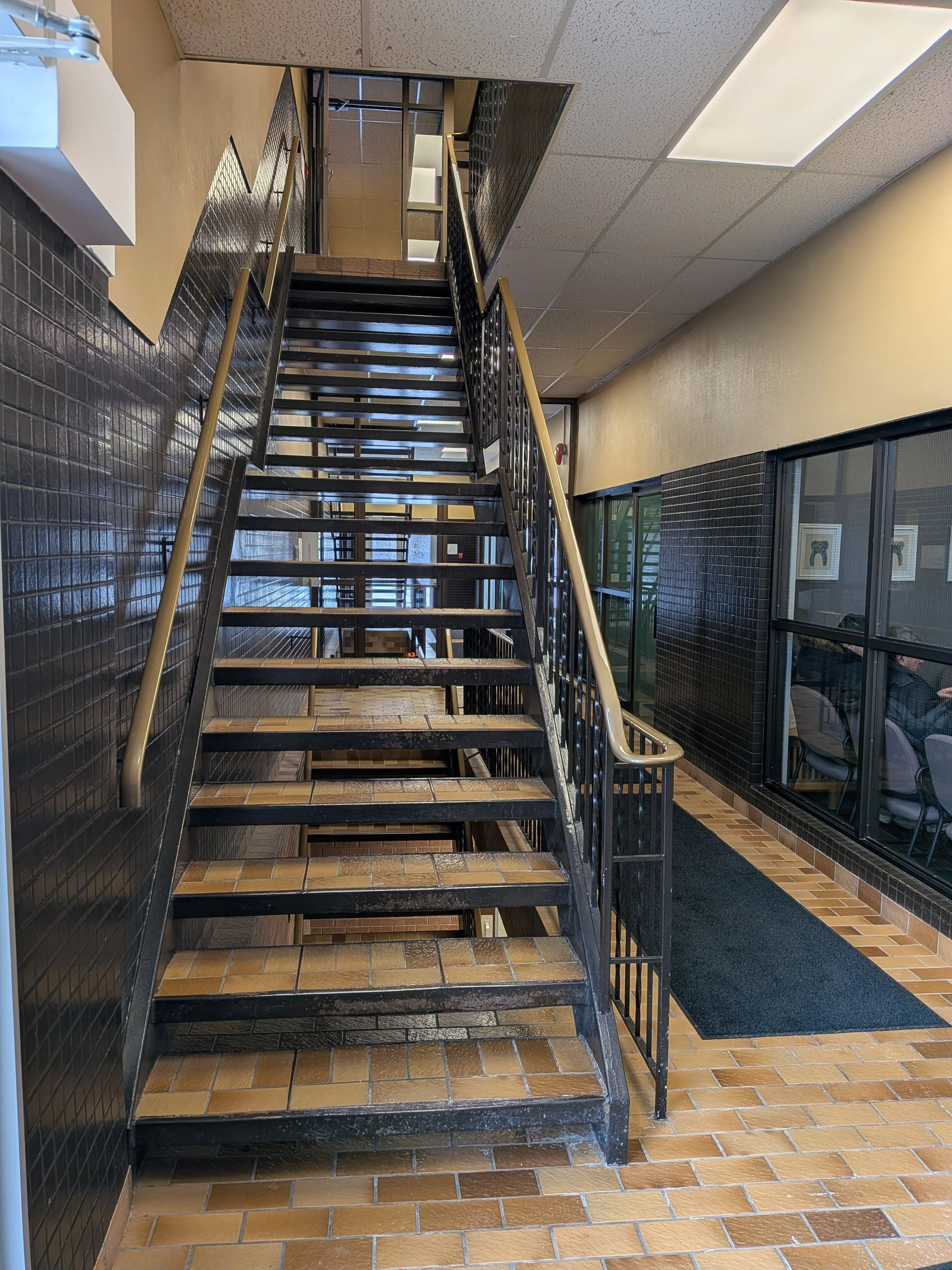 Once you enter, you'll see a set of stairs that will take you to the upper level, or you can use the elevator located past the stairs and to the left. 