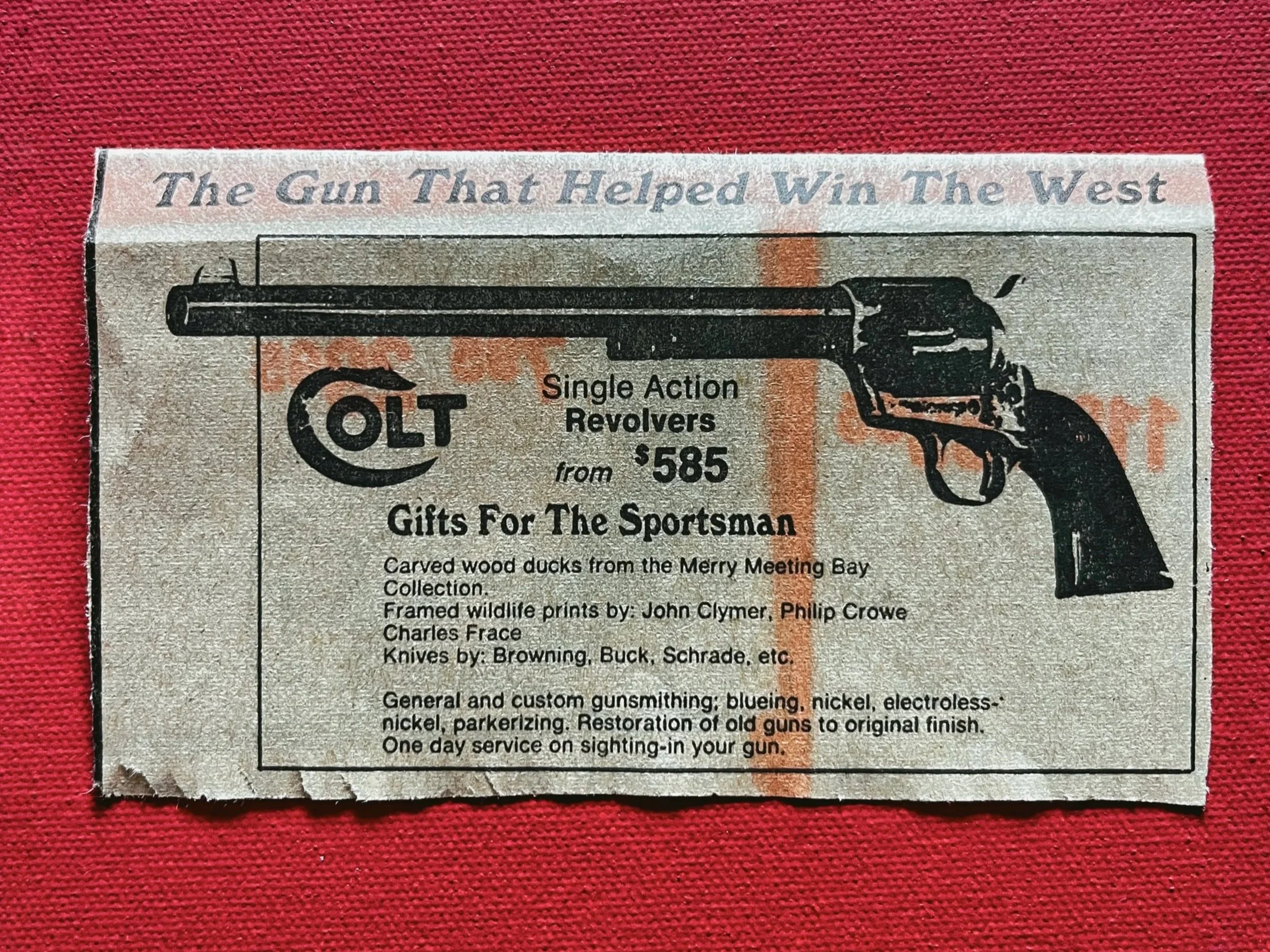 Close up image of newspaper clipping showing Colt 45 Ad