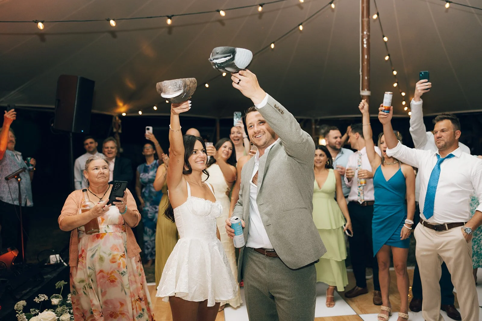 BRIDE GROOM WEDDING RECEPTION DUCK DRINK CHEERS GUESTS