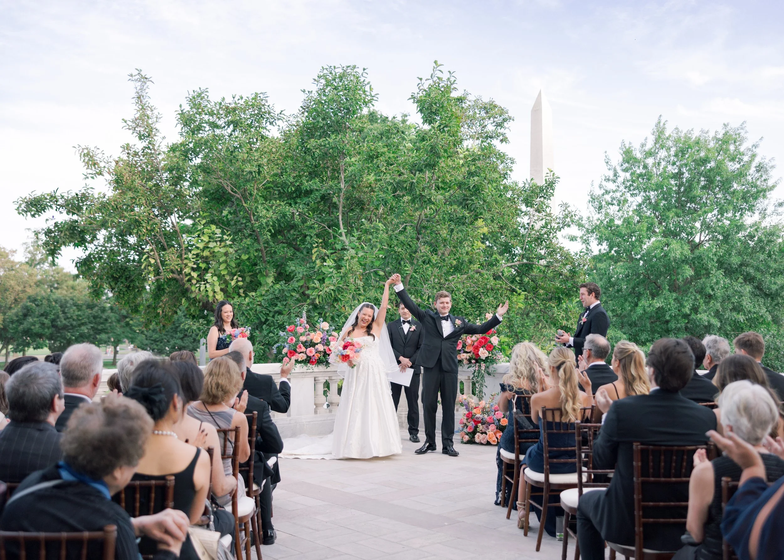 BRIDE GROOM BOUQUET WEDDING CEREMONY FLORAL ARCH DESIGN WASHINGTON DC MONUMENT DAR DAUGHTERS AMERICAN REVOLUTION COLORFUL VIBRANT BOLD