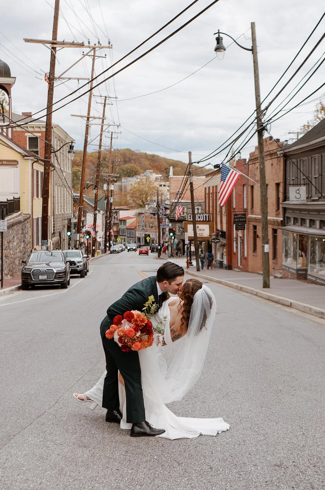 bride groom kiss flower floral bridal bouquet wedding autumn main street ballroom ellicott city maryland