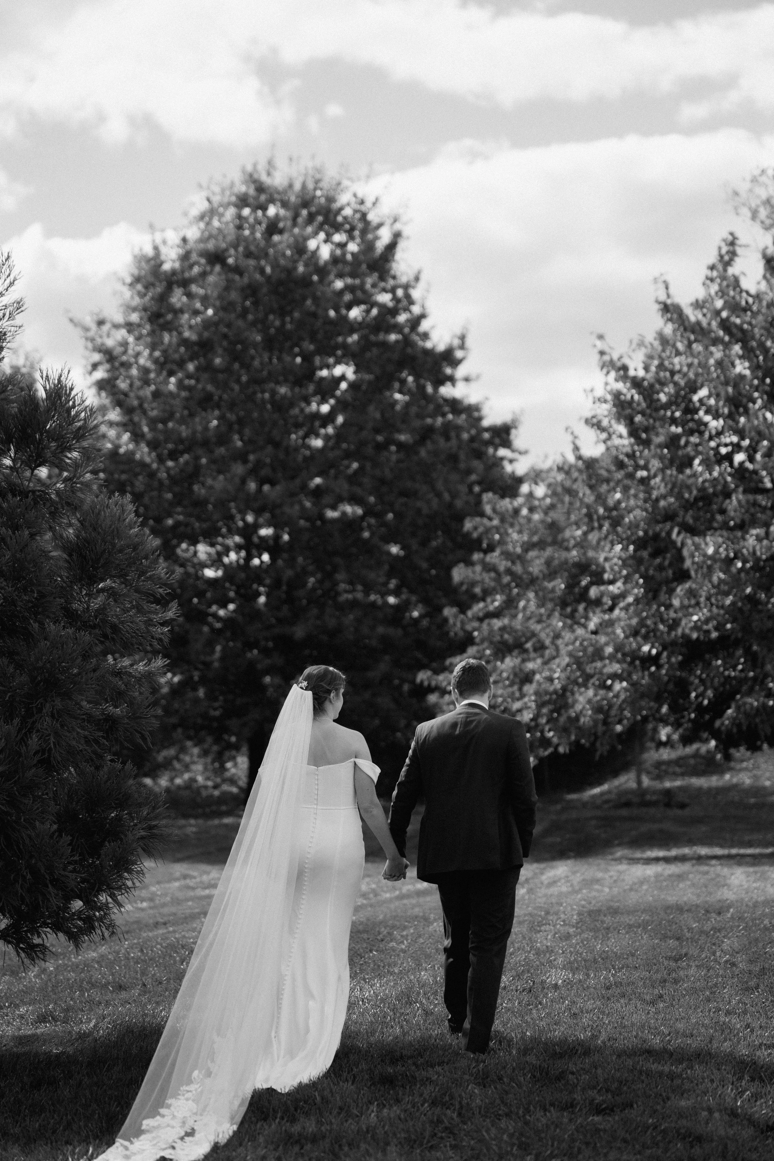 BRIDE GROOM HOLDING HANDS WEDDING CEREMONY PORTRAIT SWEENEY BARN VIRGINIA