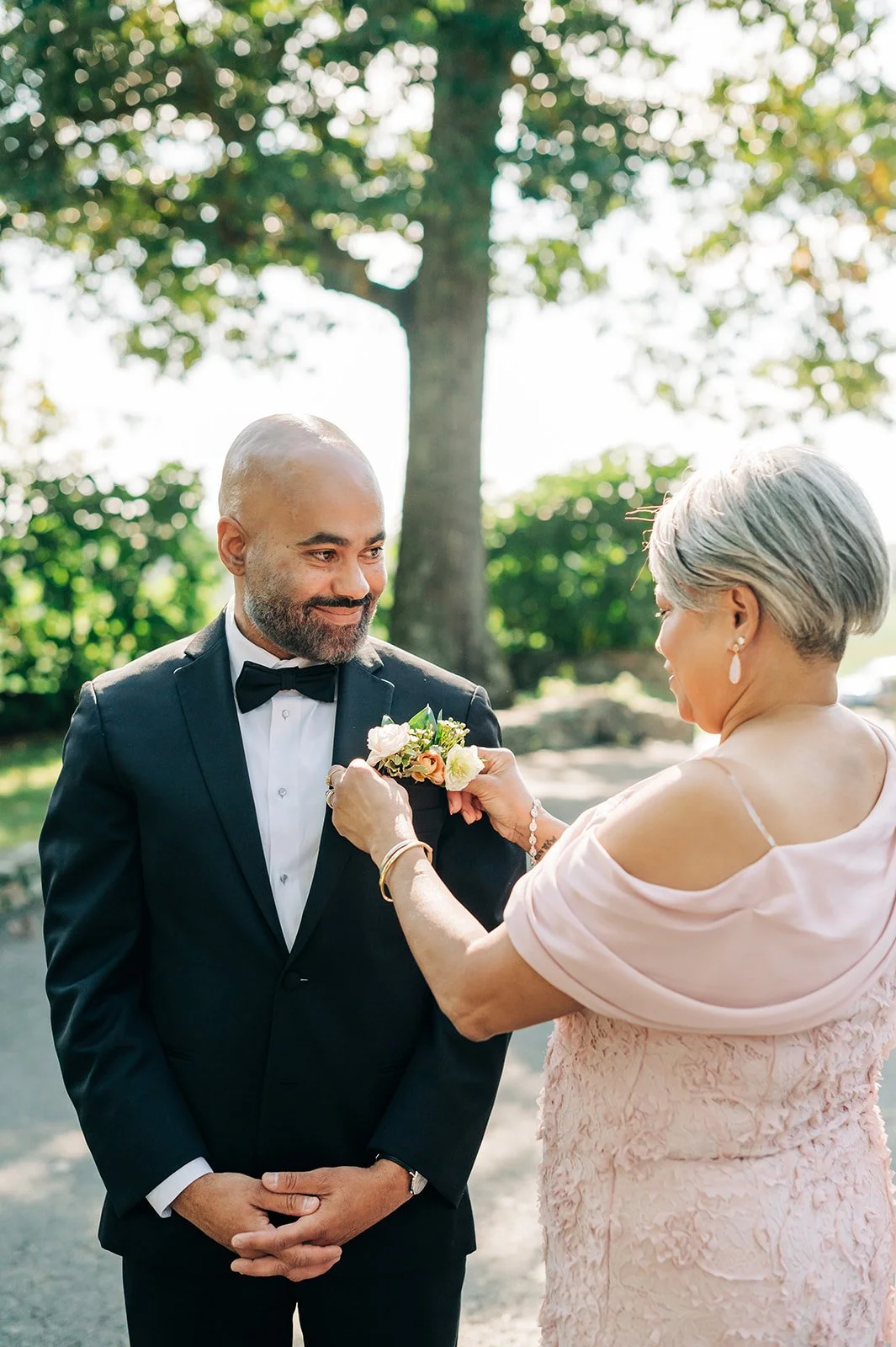 mom pinning groom boutonniere goodstone inn restaurant