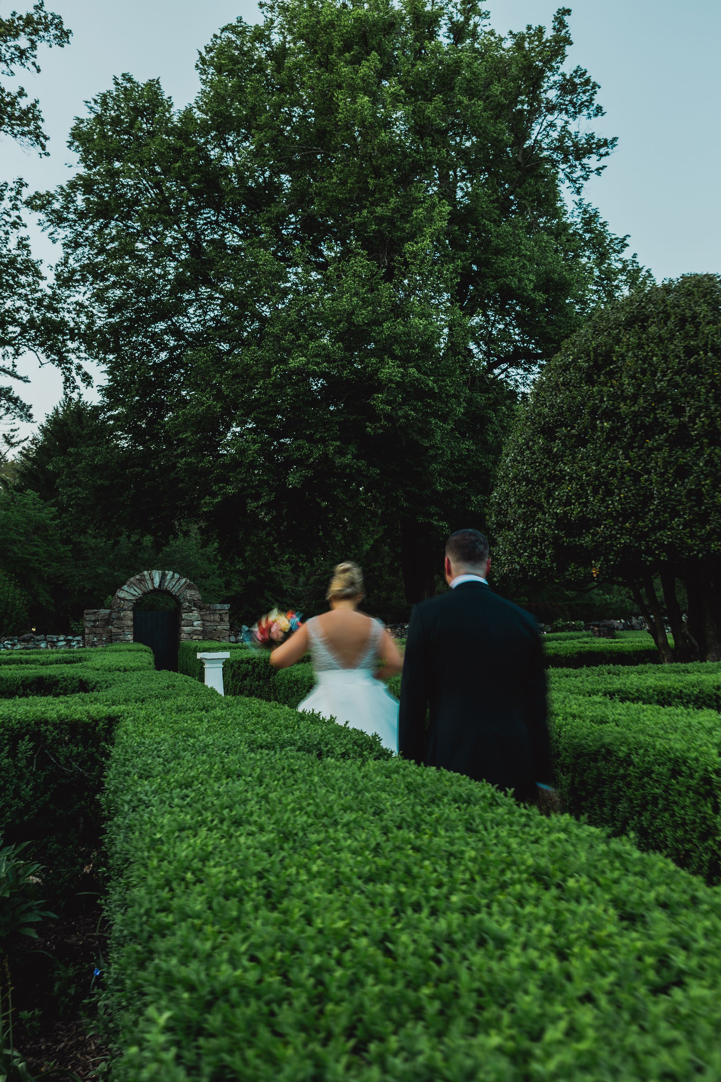 BRIDE GROOM COLORFUL FLORAL BRIDAL BOUQUET FROLICKING THROUGH GARDEN