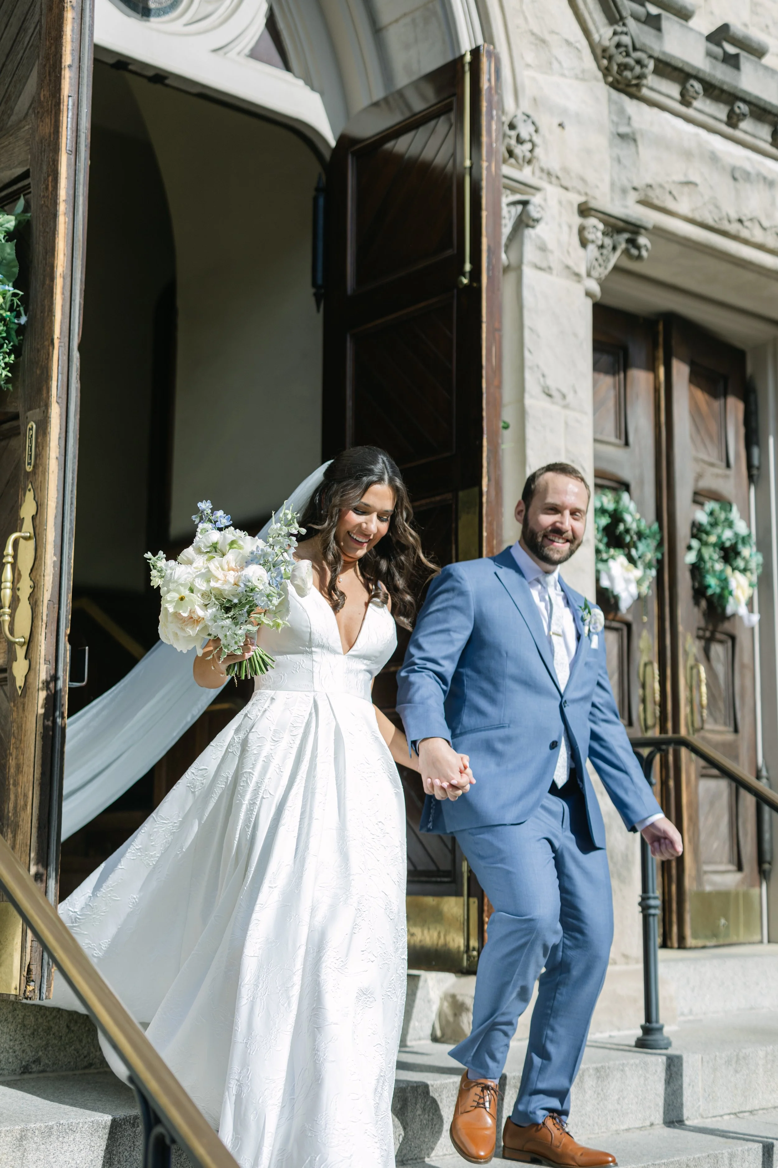 BRIDE GROOM EXIT CHURCH WEDDING BLUE WHITE FLORAL BOUQUET