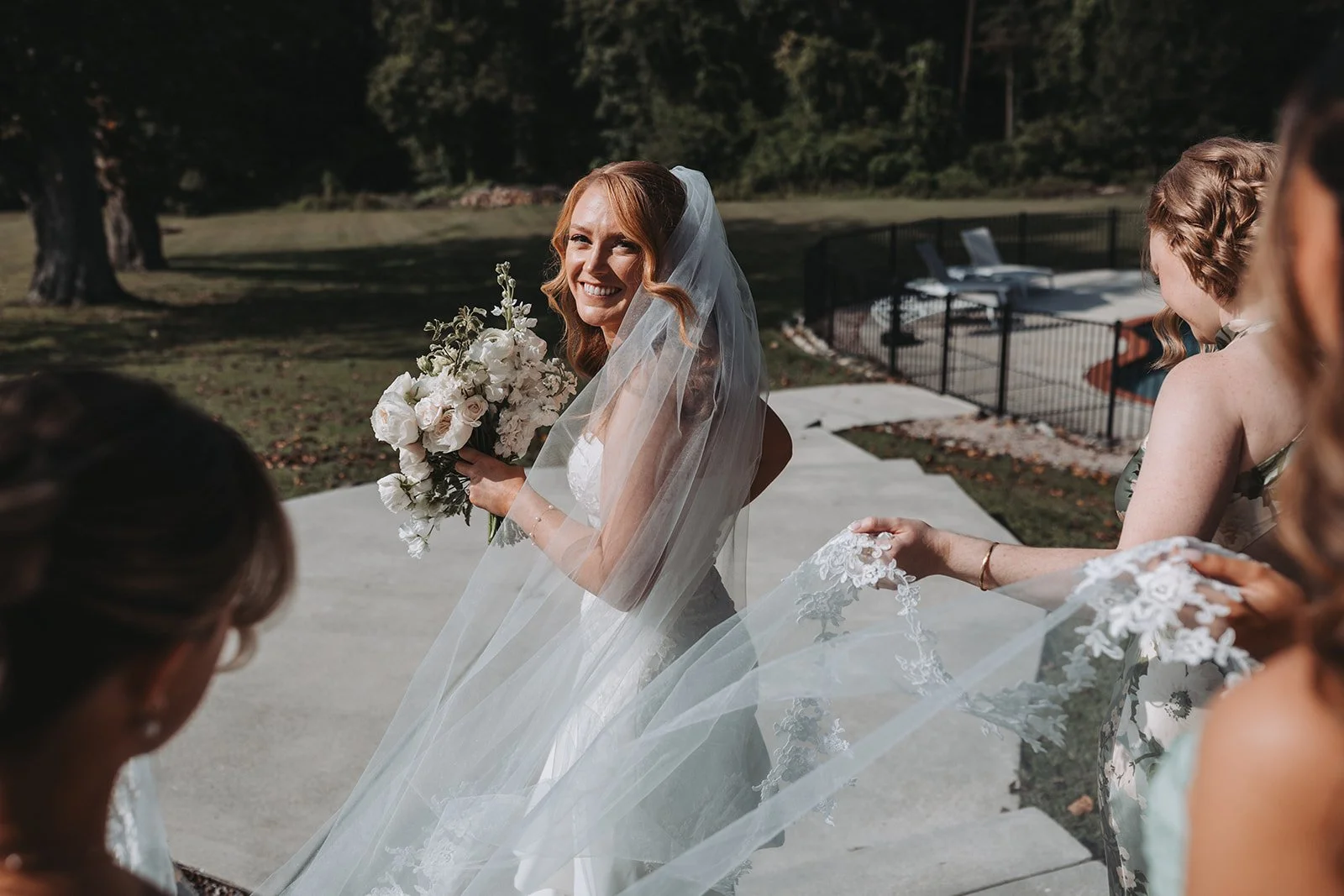 BRIDE BRIDAL BOUQUET WHITE FLORAL WITH BRIDESMAIDS WATCHING
