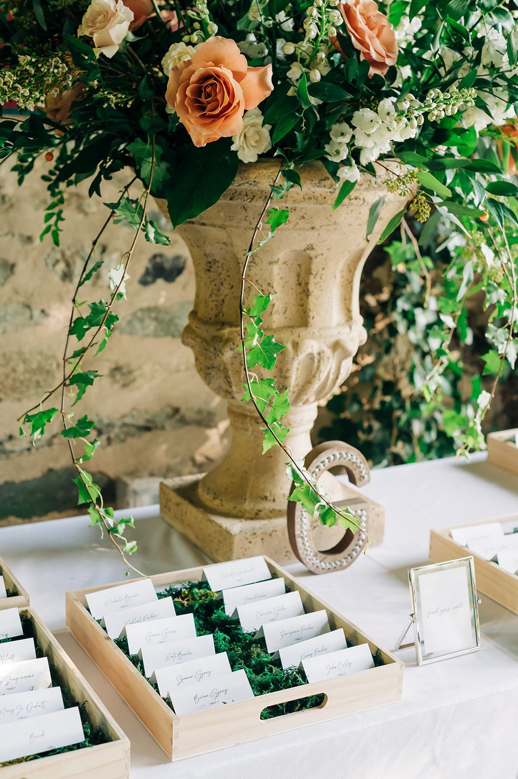 wedding reception floral arrangement urn large flowers escort cards goodstone inn restaurant outdoor