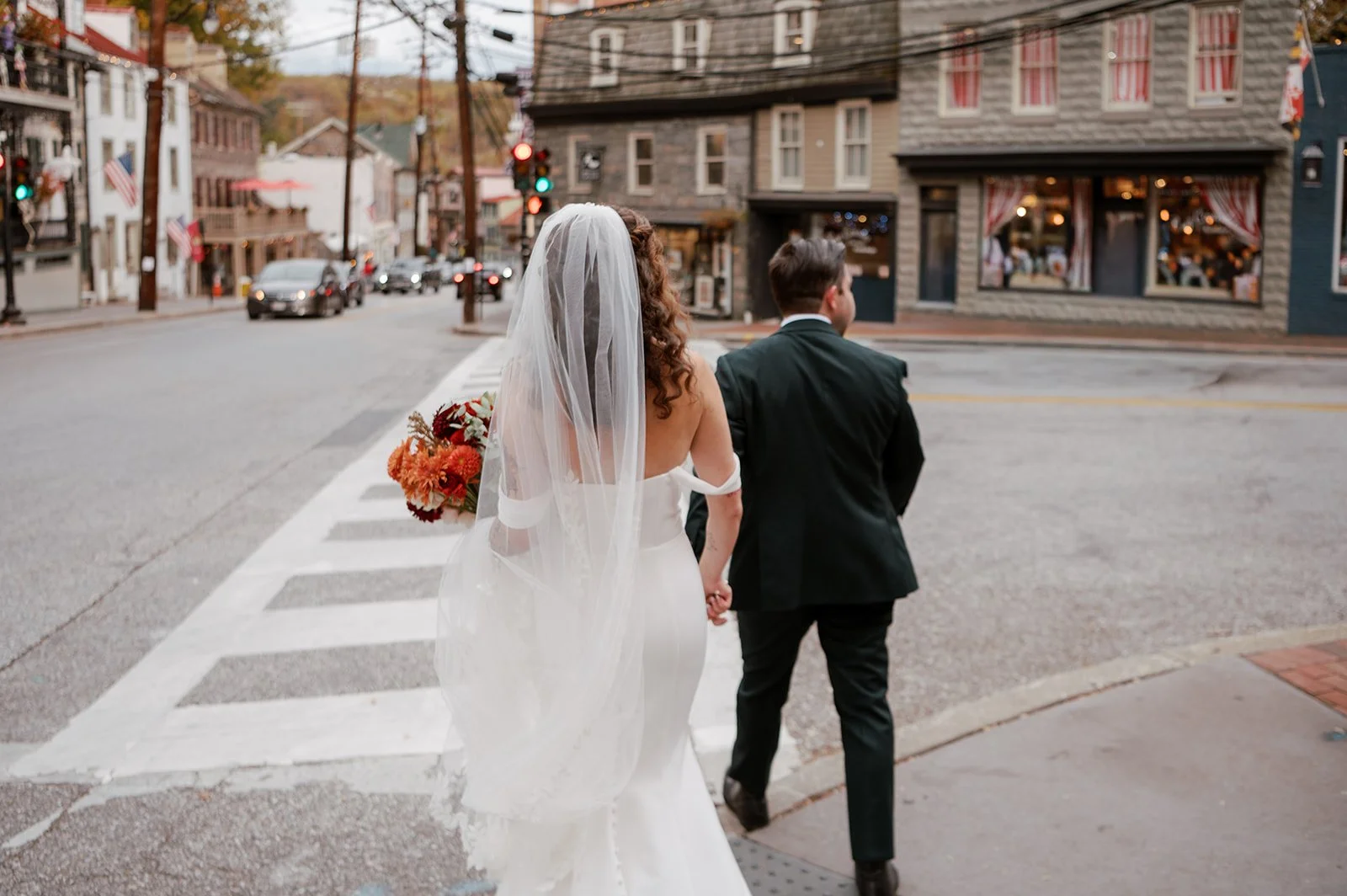 BRIDE GROOM BOUQUET CROSSWALK ELLICOTT CITY WEDDING PORTRAIT MAIN STREET BALLROOM ELLICOTT MARYLAND