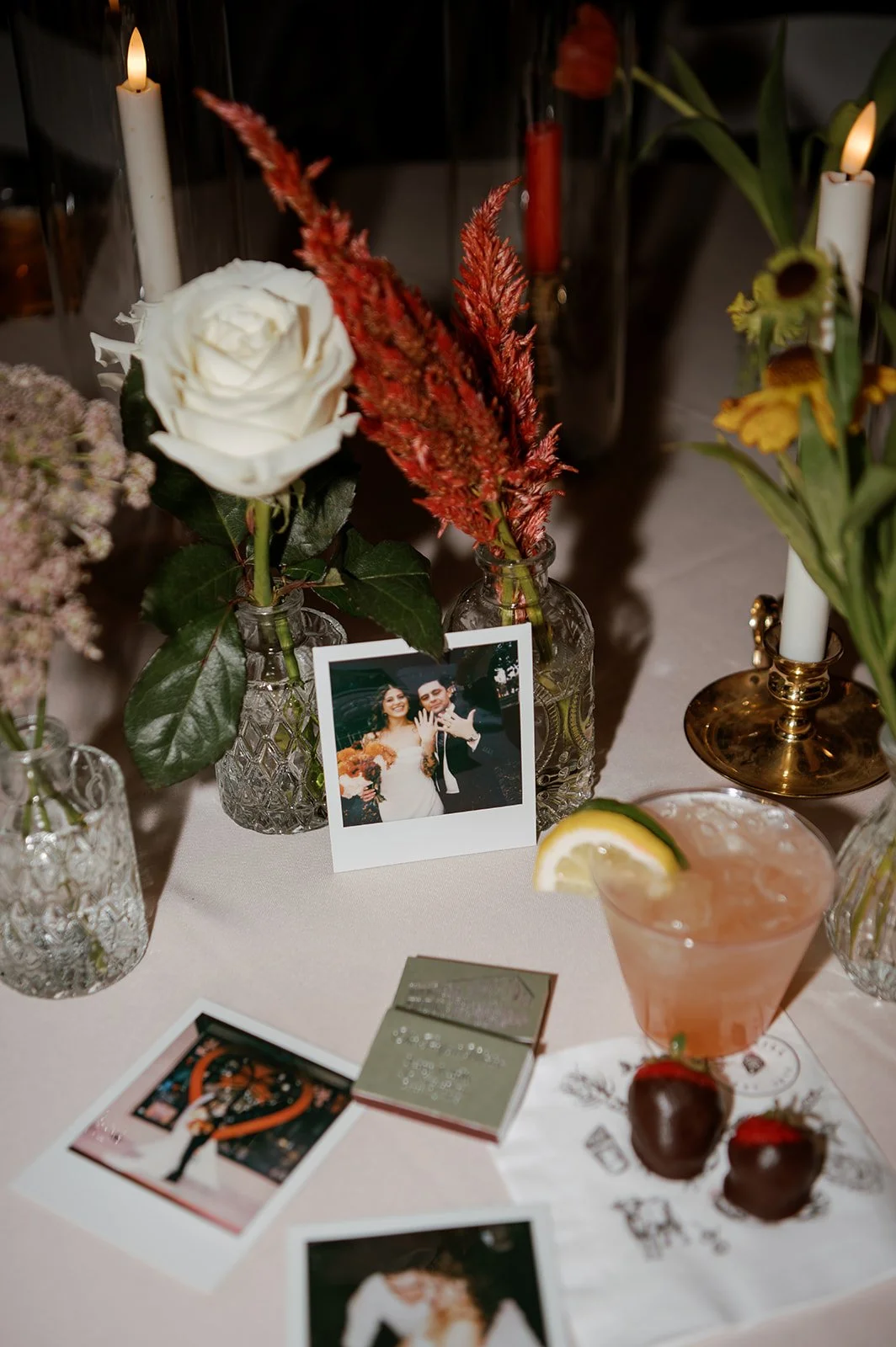 flower floral arrangement bud vase polaroid chocolate strawberry matches cocktail wedding reception table decor autumn main street ballroom ellicott city maryland